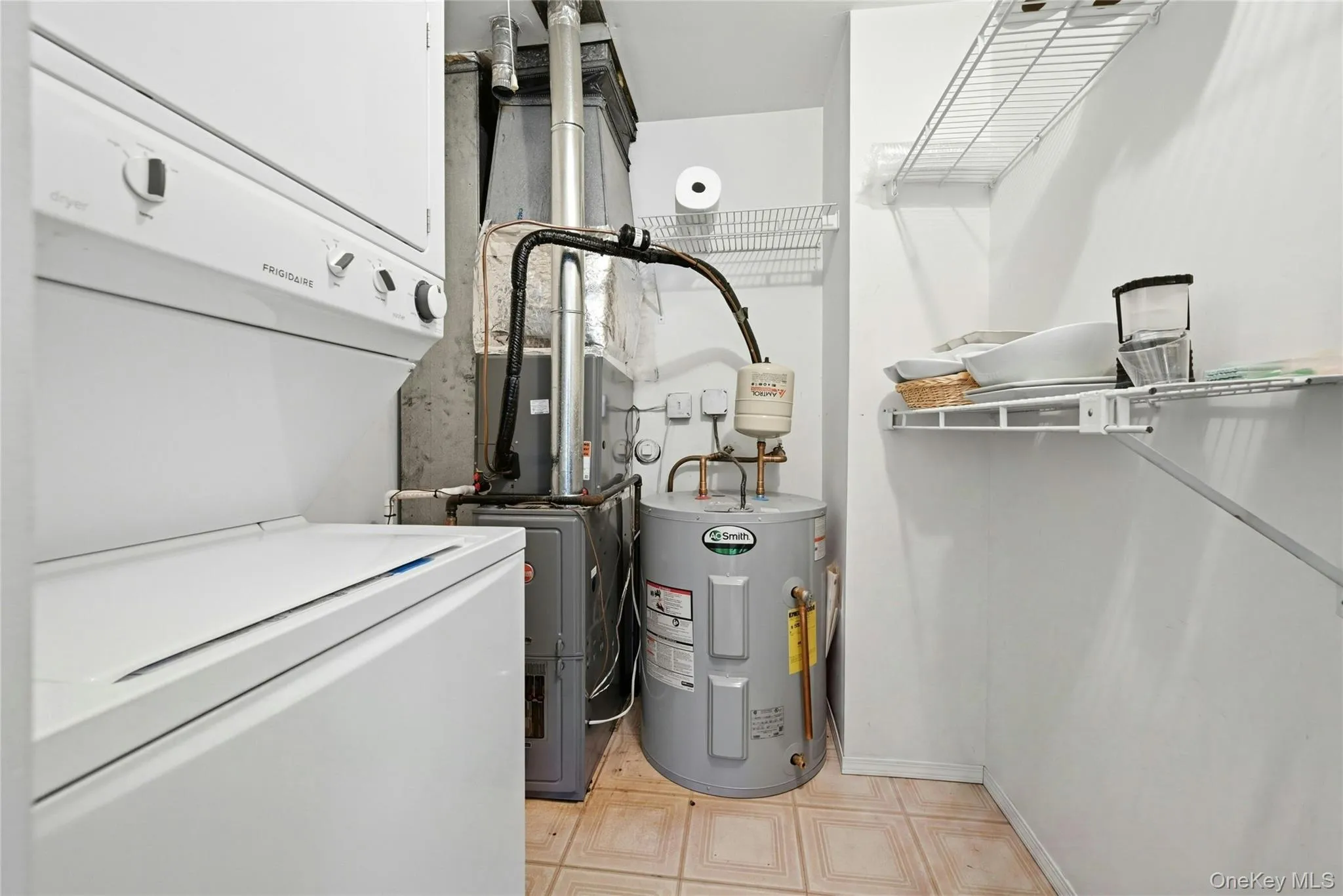 Utility Room With An Updated Rheem Gas Heating System, AO Smith Hot Water Heater. Washer & Dryer, And Pull Down Attic Storage. Utility Room With An Updated Rheem Gas Heating System, AO Smith Hot Water Heater. Washer & Dryer, And Pull Down Attic Storage.
