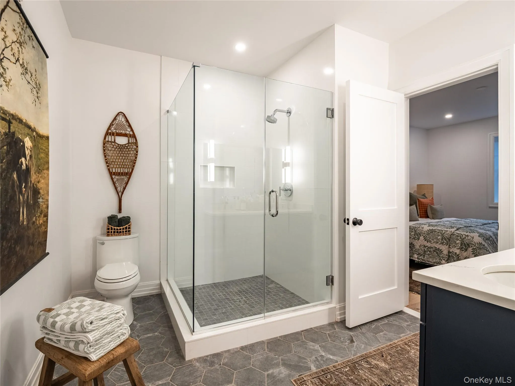 Ensuite bathroom featuring vanity and a shower stall Ensuite bathroom featuring vanity and a shower stall