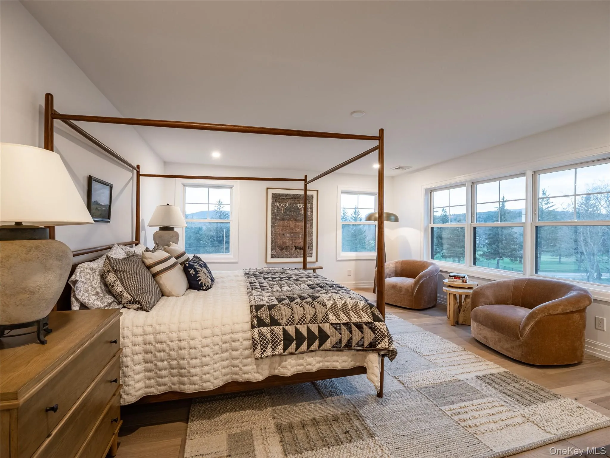 Bedroom featuring light wood finished floors and recessed lighting Bedroom featuring light wood finished floors and recessed lighting