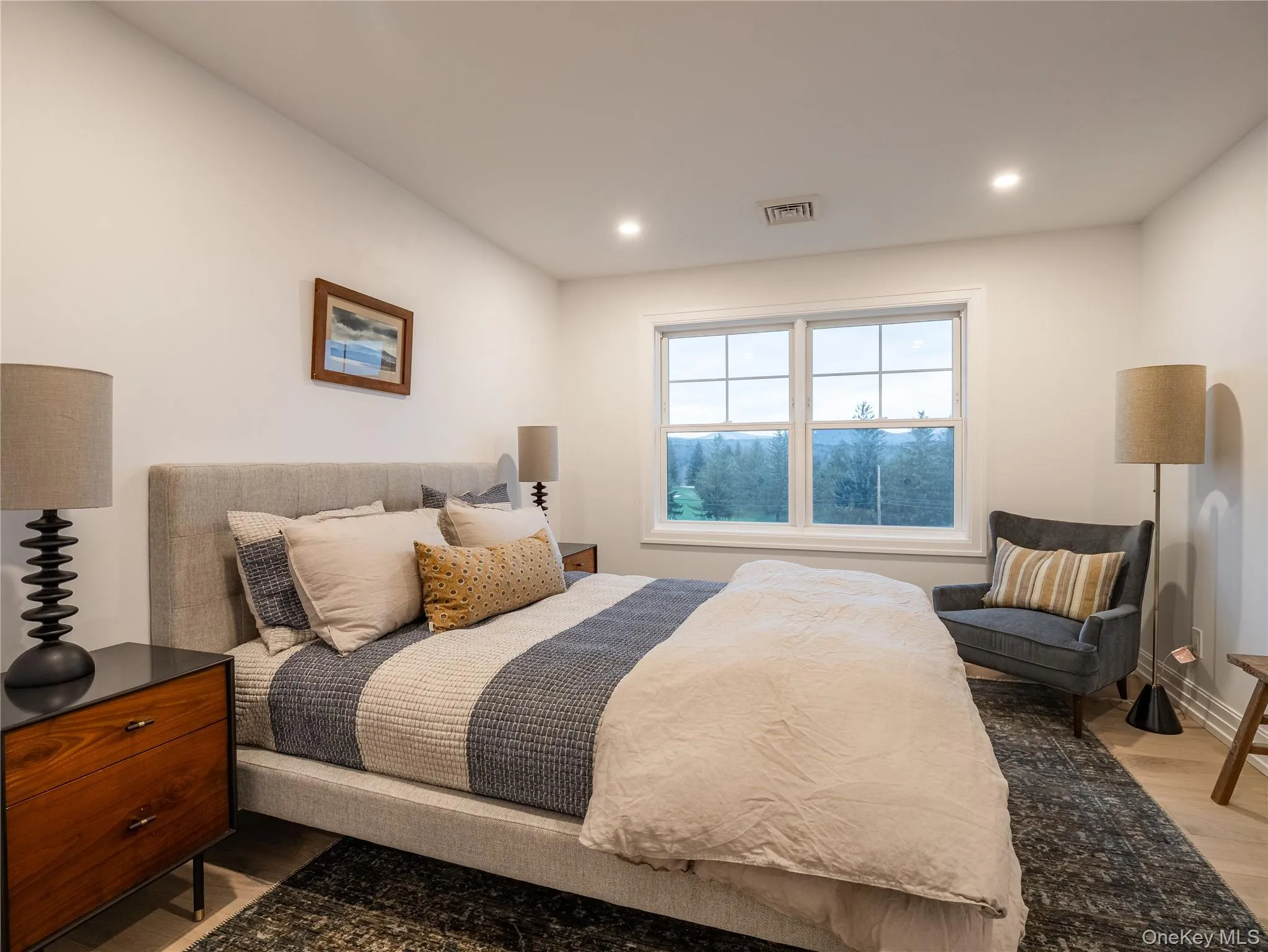 Bedroom featuring recessed lighting and light wood finished floors Bedroom featuring recessed lighting and light wood finished floors