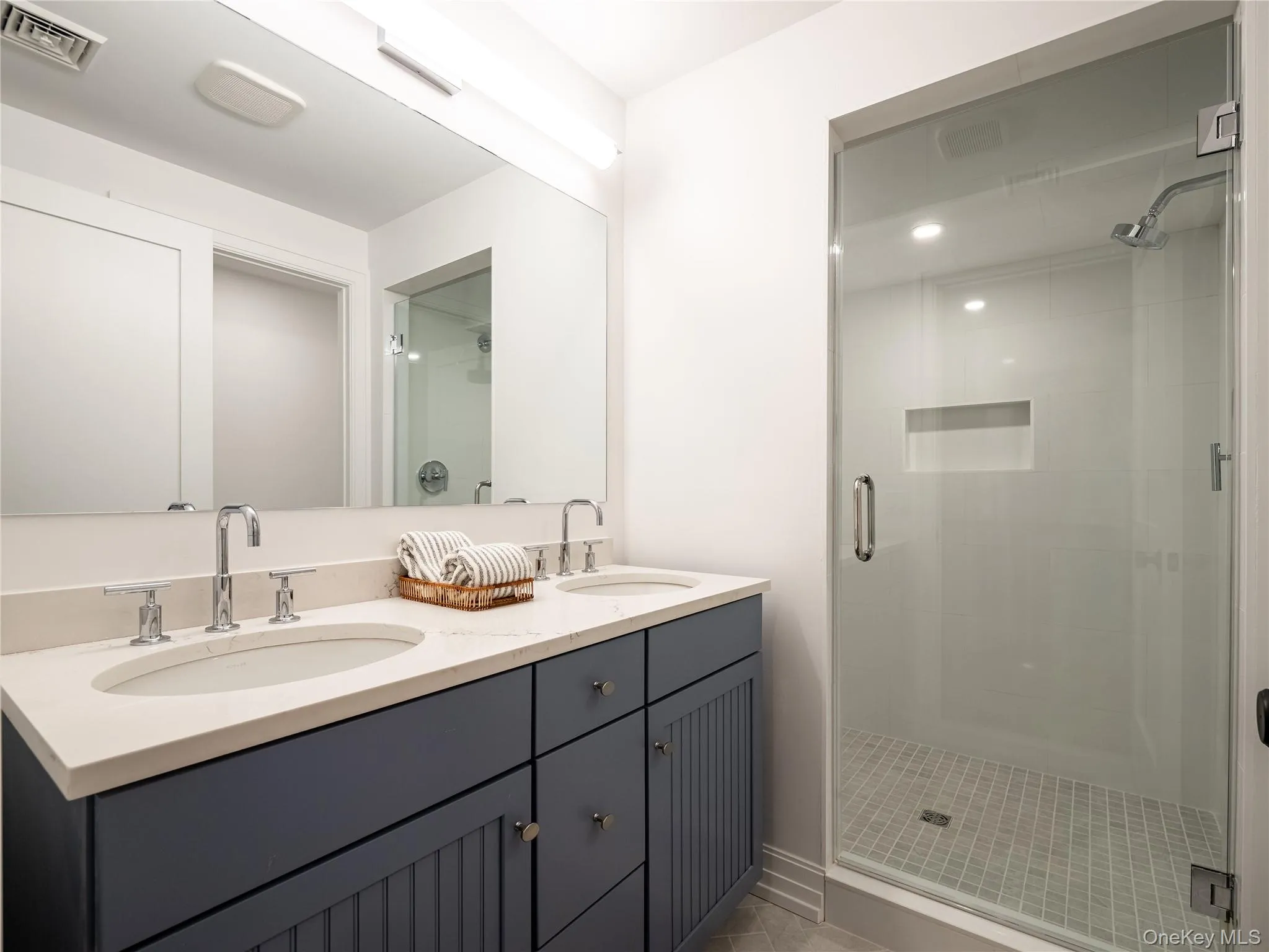 Bathroom with a shower stall and double vanity Bathroom with a shower stall and double vanity
