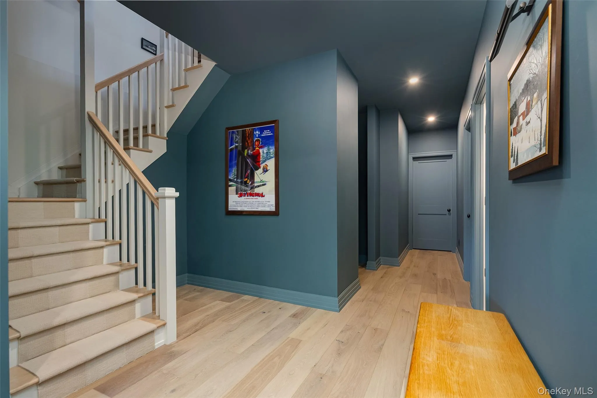 Hallway featuring recessed lighting, stairway, and light wood finished floors Hallway featuring recessed lighting, stairway, and light wood finished floors