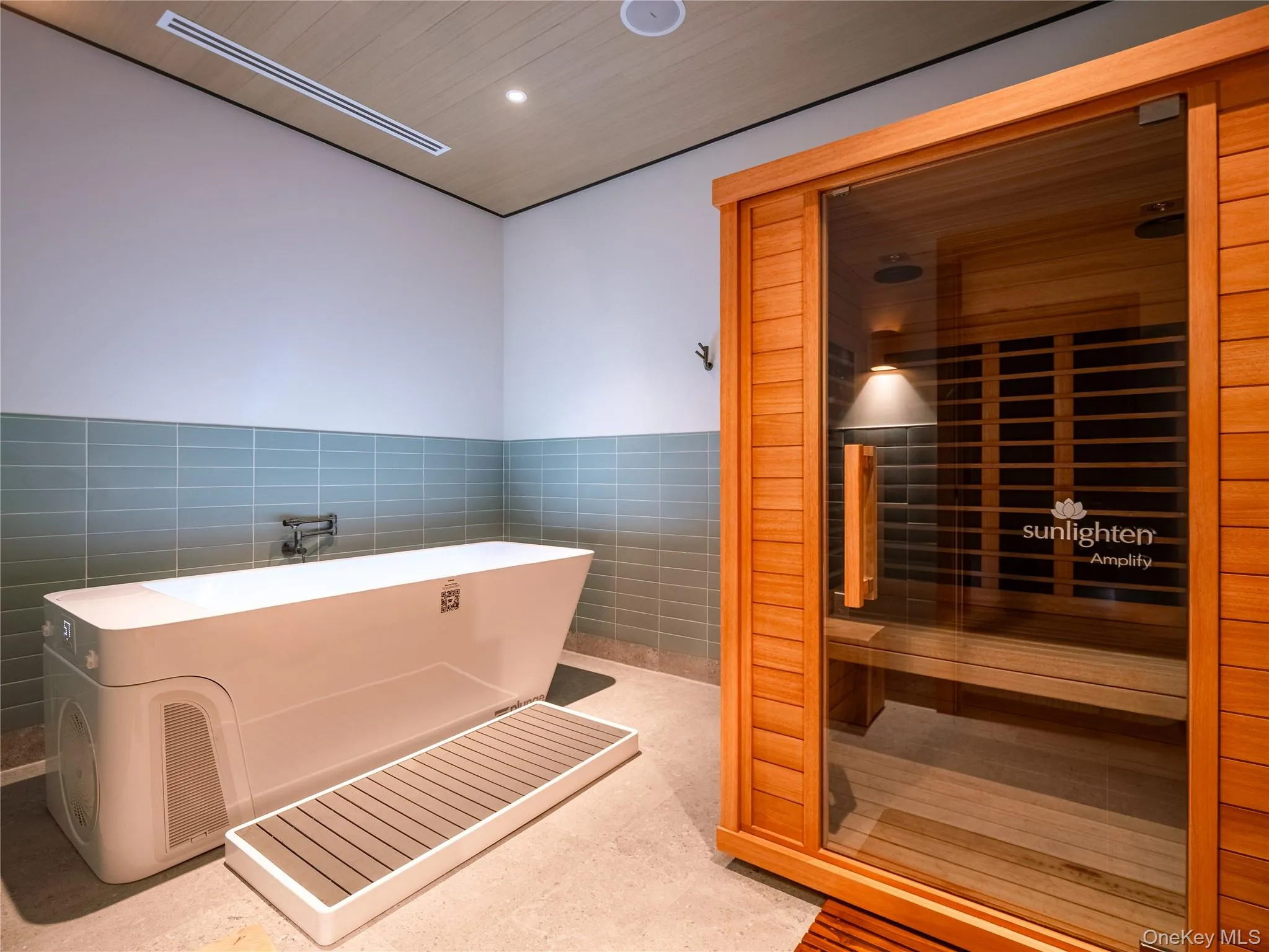 Sauna with wood ceiling, recessed lighting, and wainscoting Sauna with wood ceiling, recessed lighting, and wainscoting