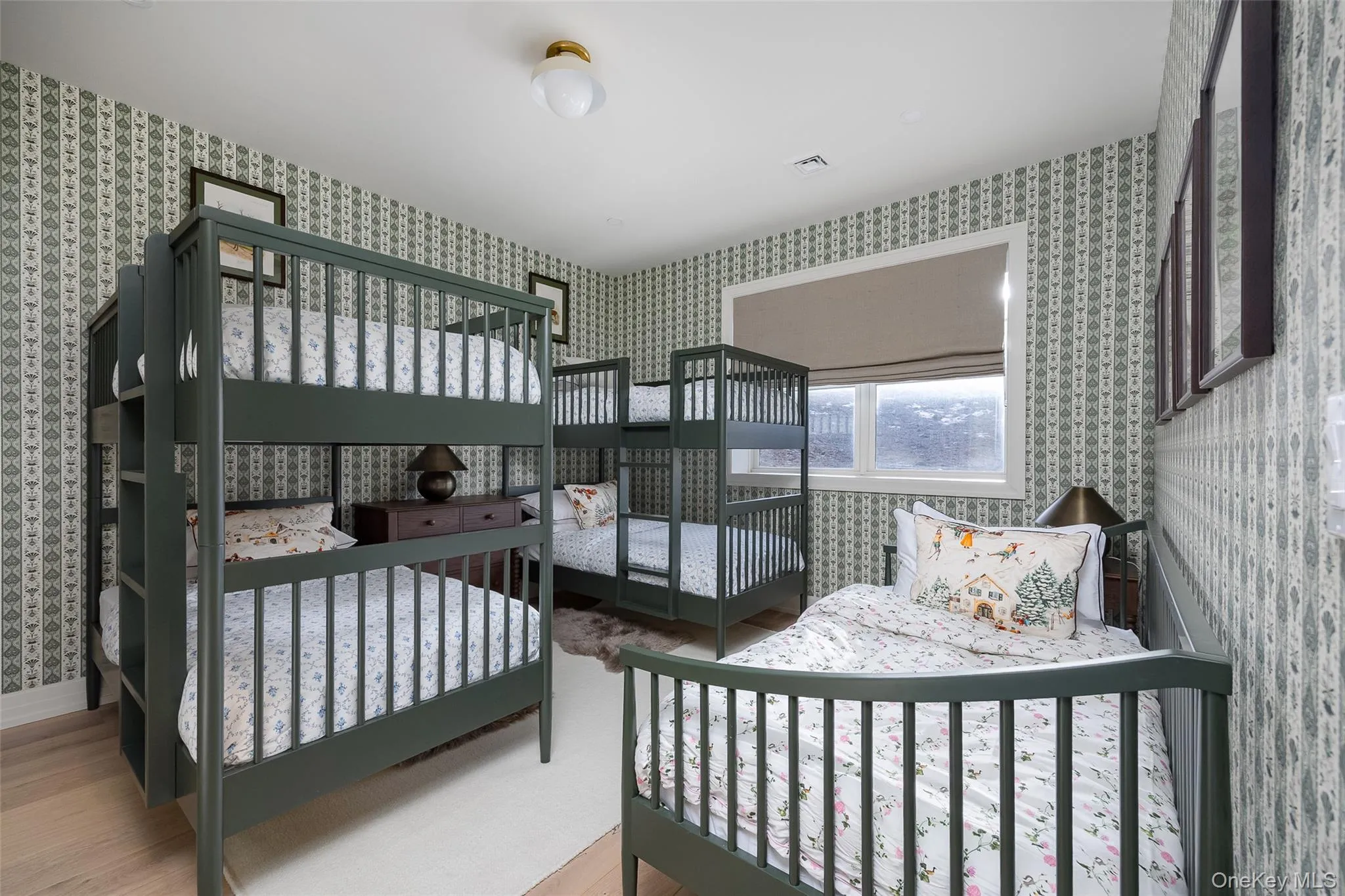 Bedroom featuring wallpapered walls Bedroom featuring wallpapered walls