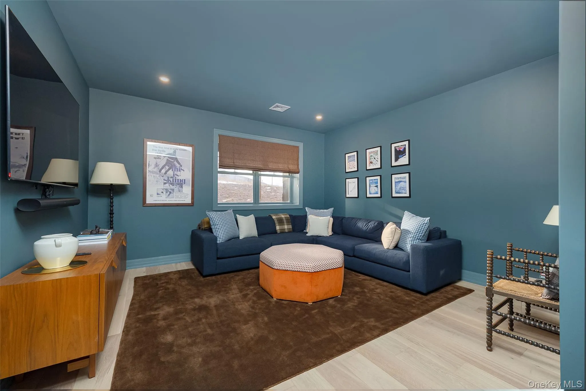 Living area featuring light wood-type flooring and recessed lighting Living area featuring light wood-type flooring and recessed lighting