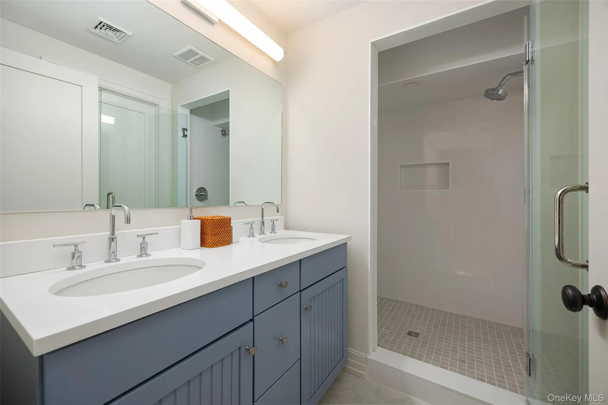 Bathroom with double vanity and a stall shower Bathroom with double vanity and a stall shower