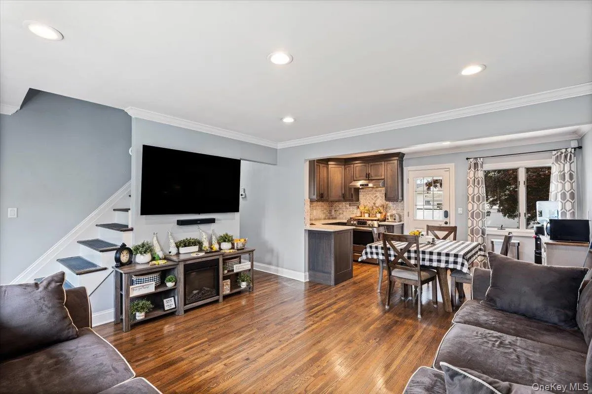 Hardwood flooring throughout, recessed lighting, and crown molding Hardwood flooring throughout, recessed lighting, and crown molding