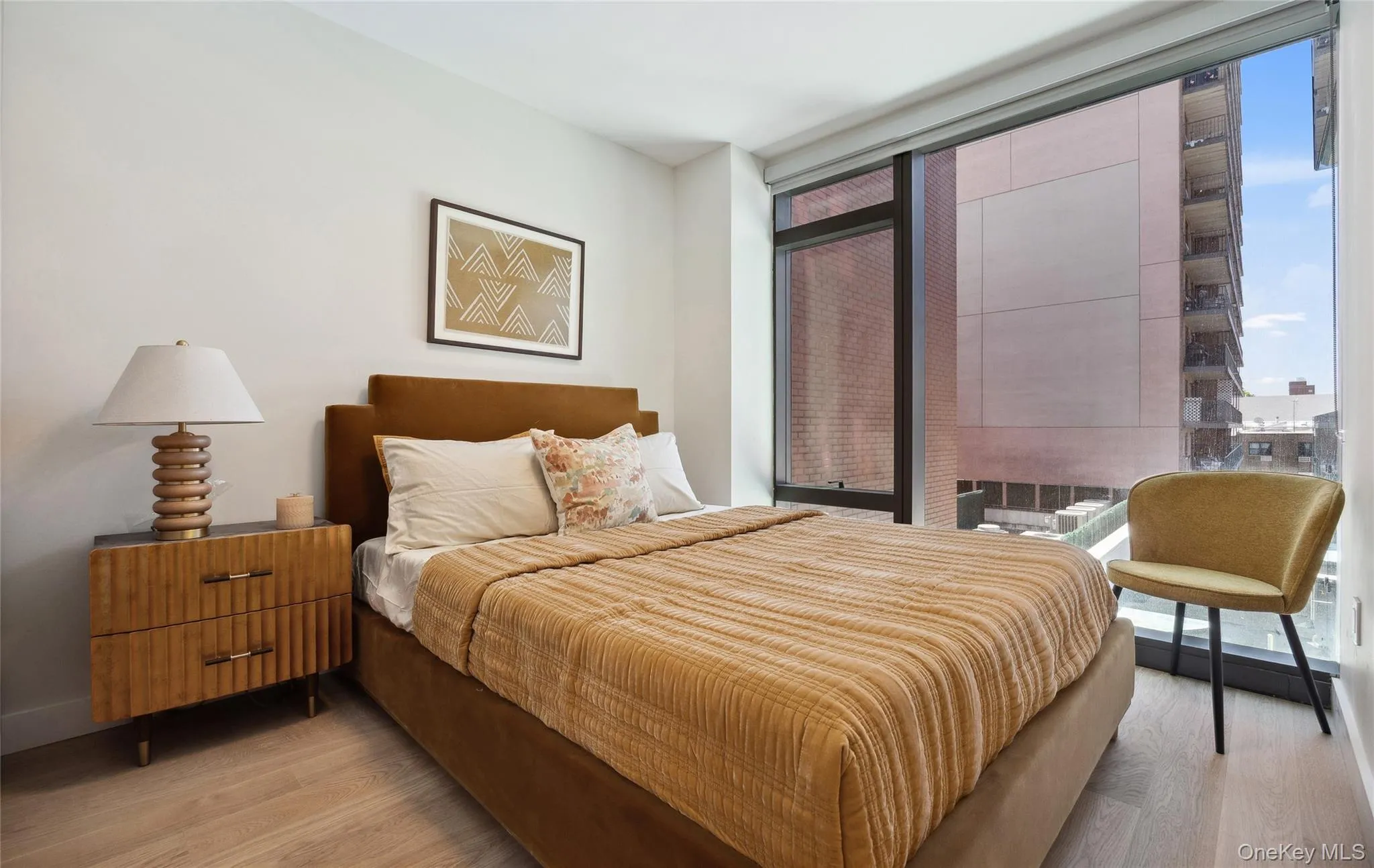 Bedroom featuring light wood finished floors Bedroom featuring light wood finished floors