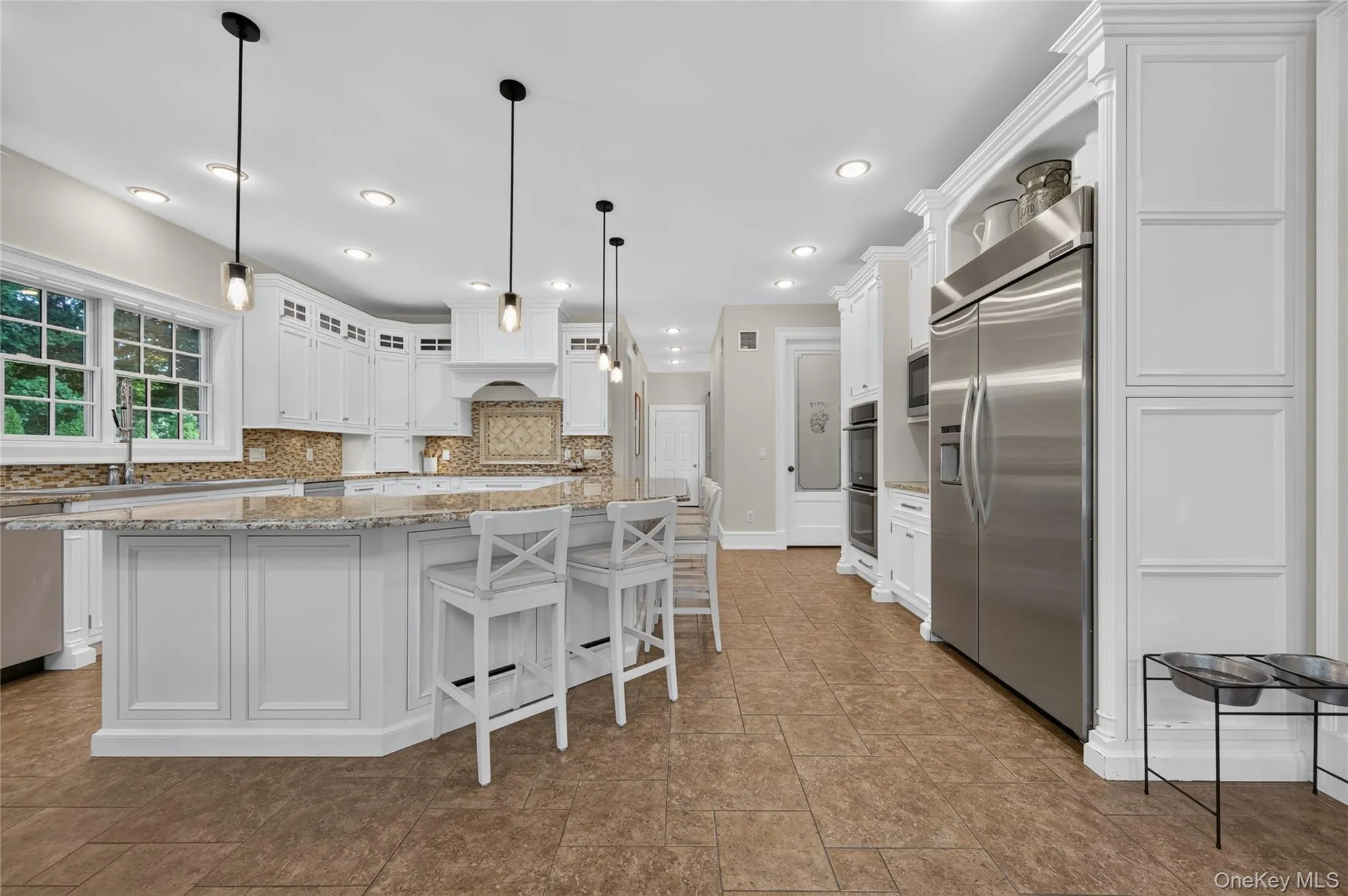 Kitchen with adjacent laundry room, mud room, access to garage Kitchen with adjacent laundry room, mud room, access to garage