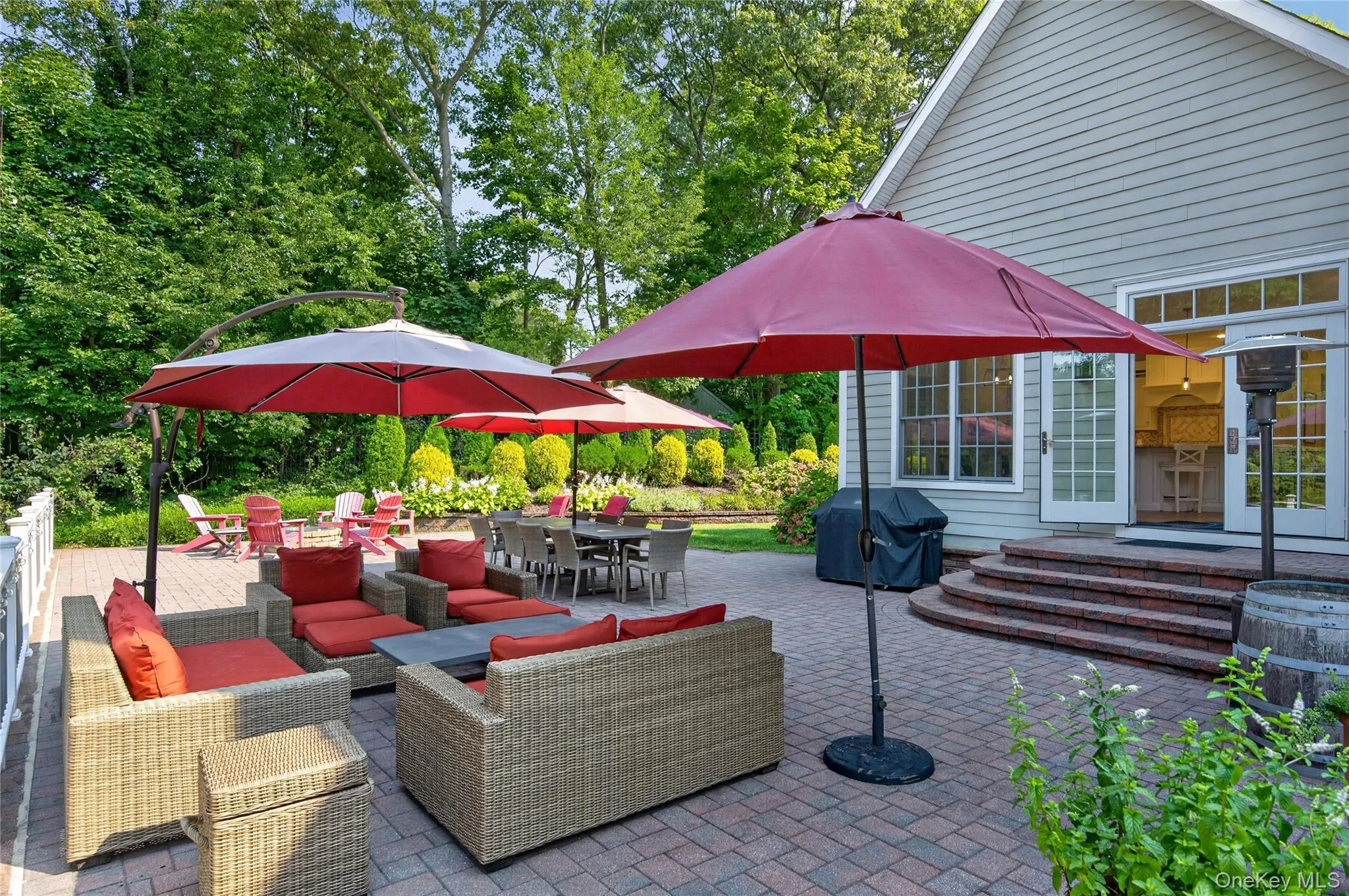 Upper patio with fire pit and lots of room for BBQing/relaxing/entertaining Upper patio with fire pit and lots of room for BBQing/relaxing/entertaining