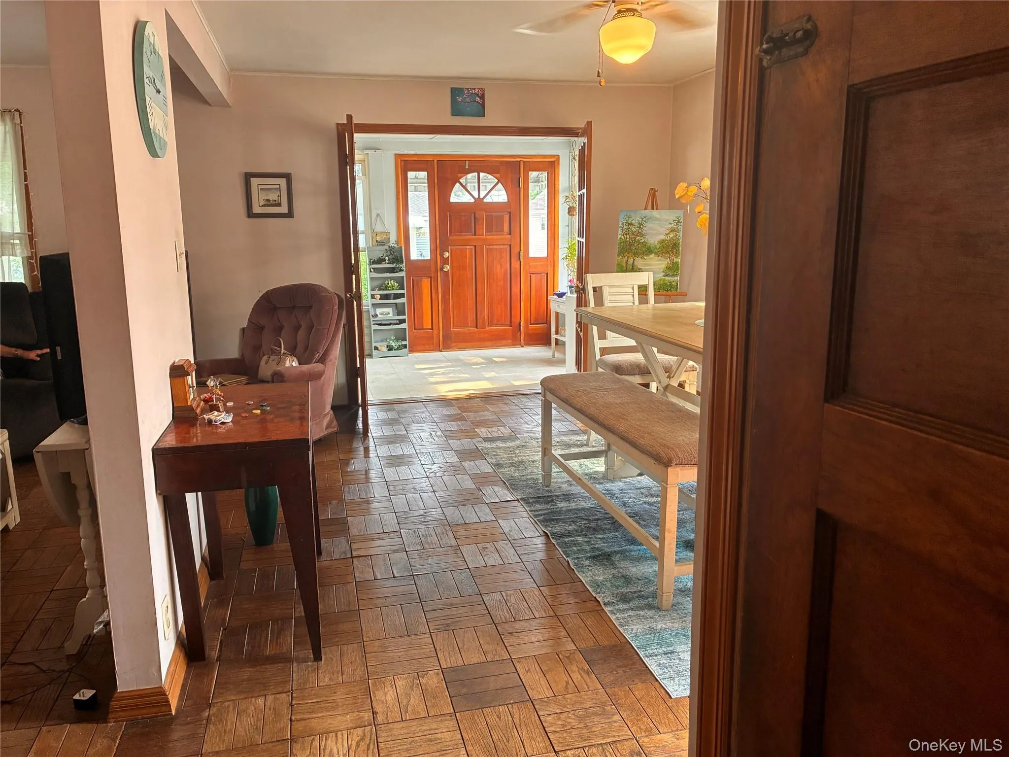 Wood-finish flooring throughout, with a solid wood entry door featuring sidelight windows Wood-finish flooring throughout, with a solid wood entry door featuring sidelight windows