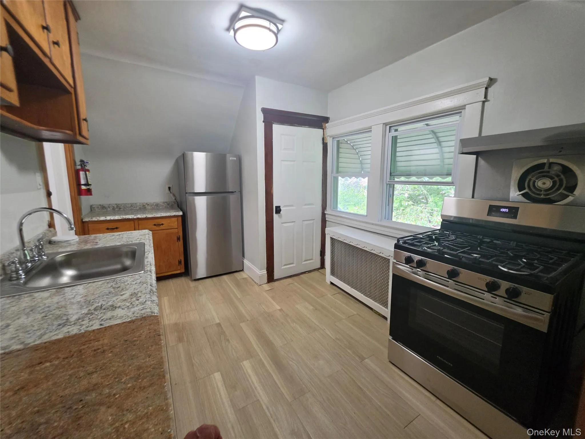 With door to 2nd entrance from back of house With door to 2nd entrance from back of house
