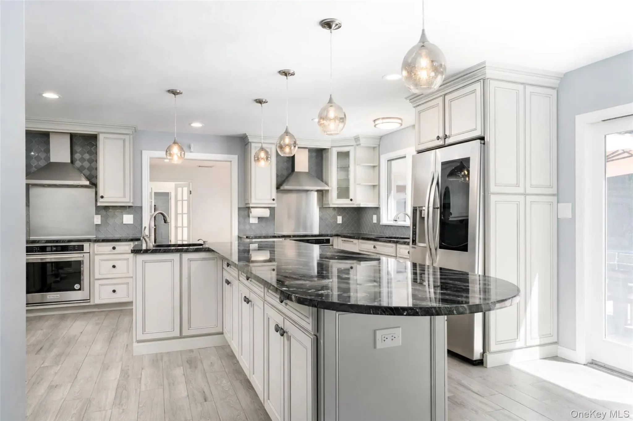 Seating center island with additional storage cabinetry Seating center island with additional storage cabinetry