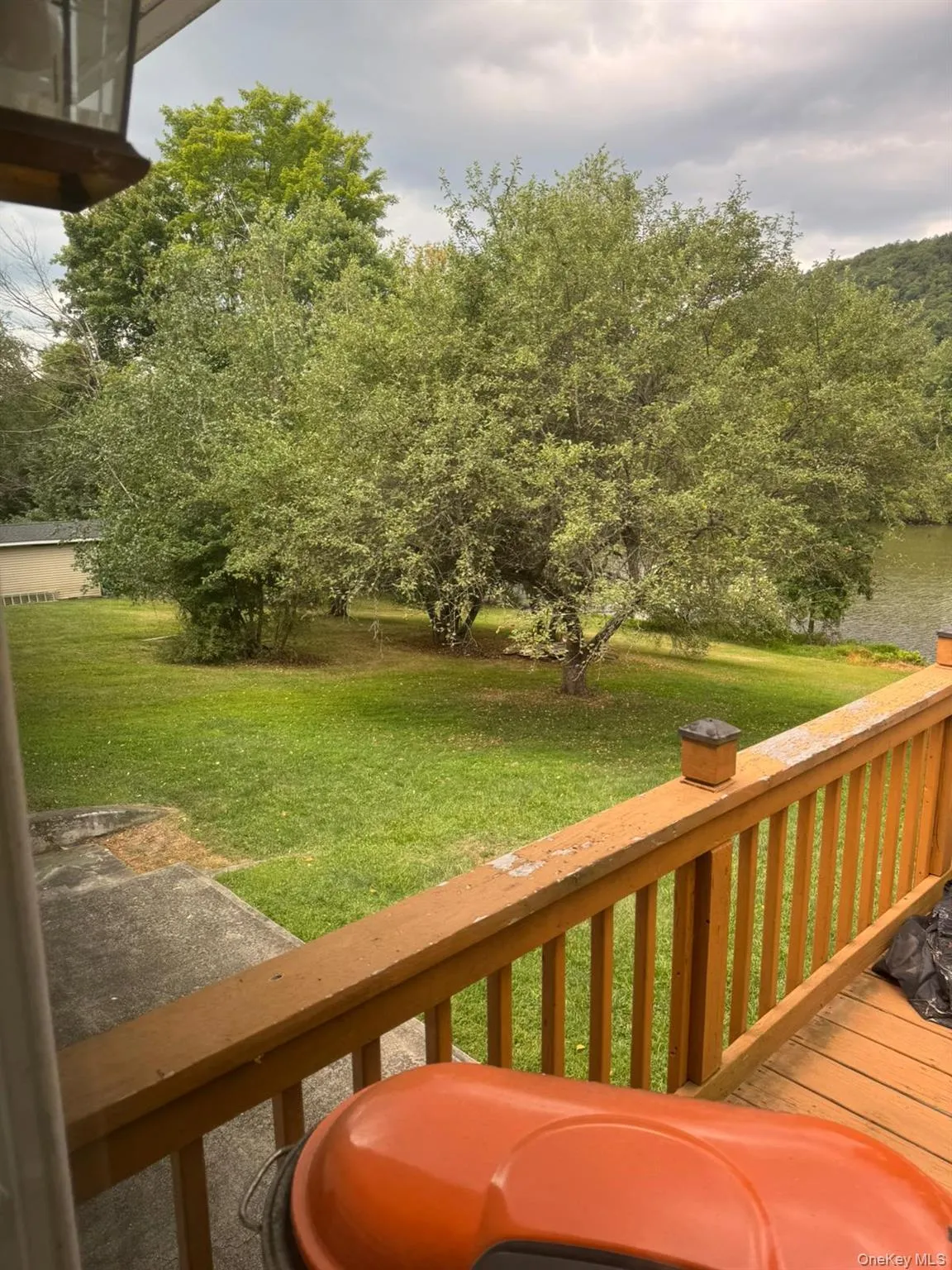 Wooden terrace featuring a yard Wooden terrace featuring a yard