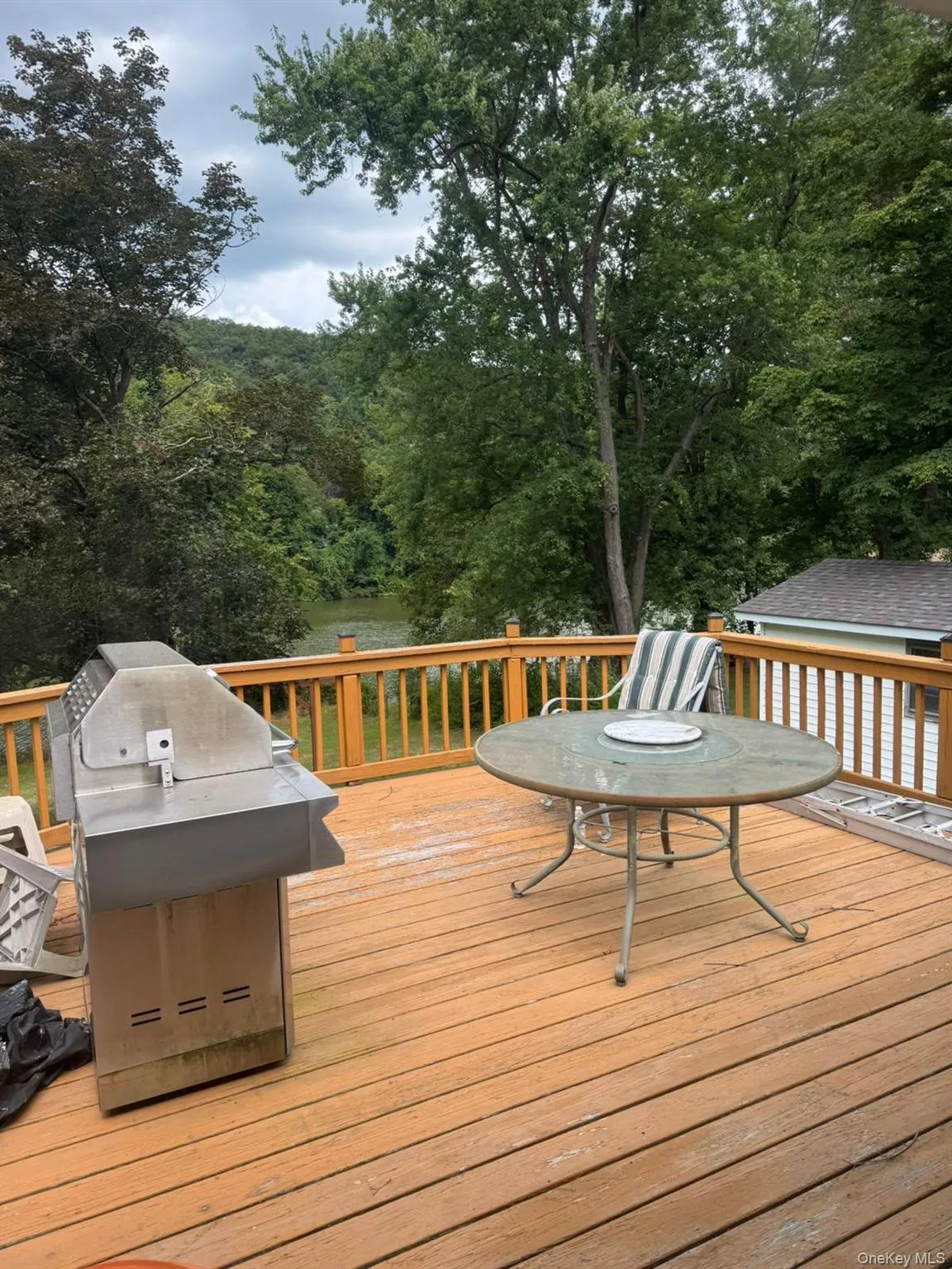 Wooden deck with a grill Wooden deck with a grill
