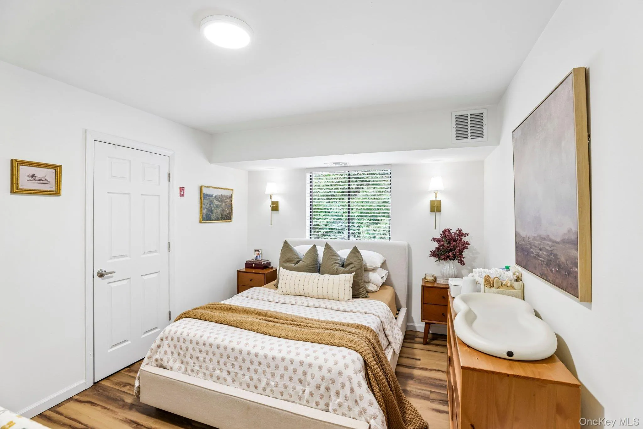 A spacious, light-filled bedroom provides a peaceful retreat to relax and unwind at the end of the day. A spacious, light-filled bedroom provides a peaceful retreat to relax and unwind at the end of the day.