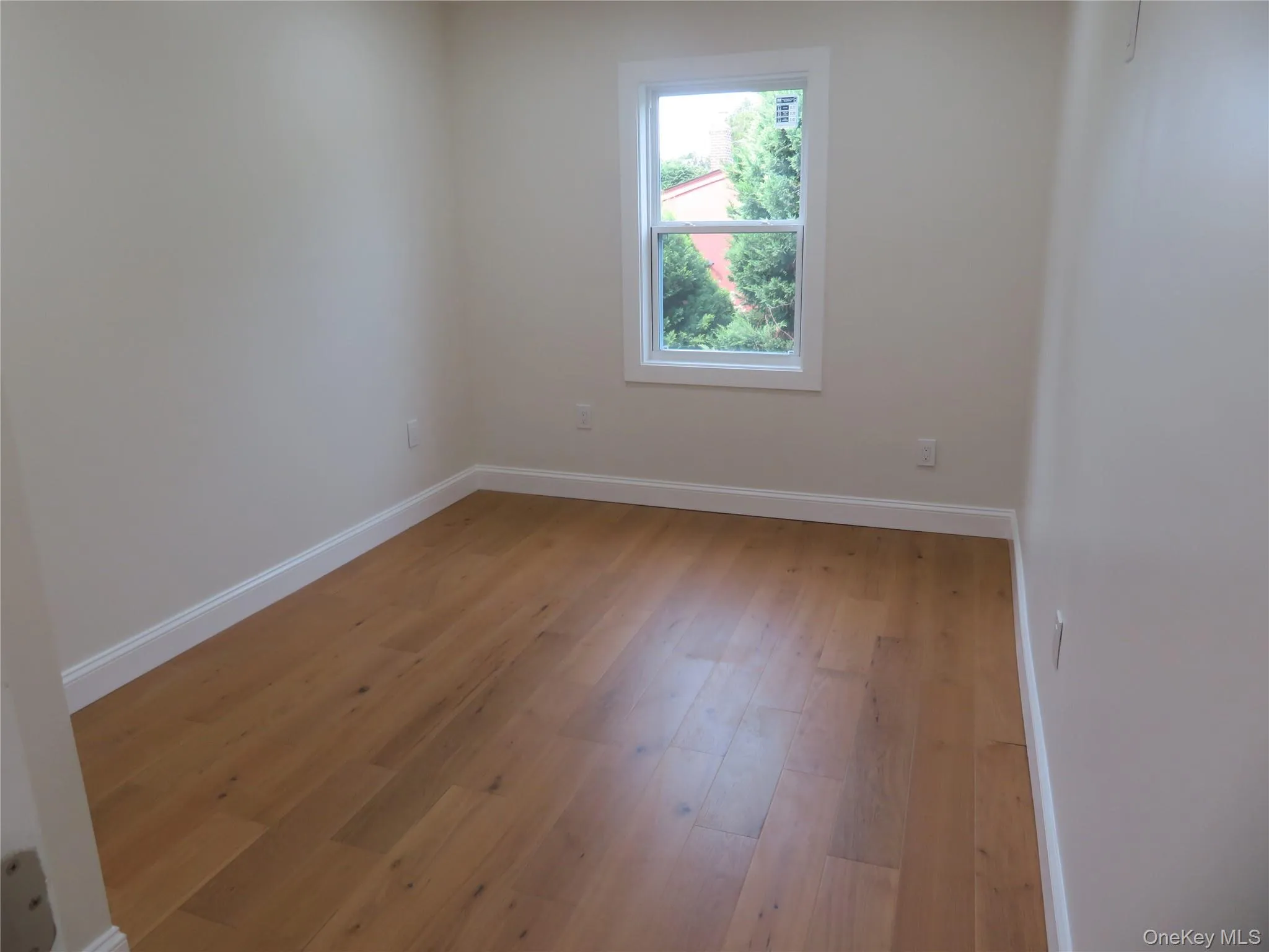 Bedroom 2 with Hardwood-style flooring throughout Bedroom 2 with Hardwood-style flooring throughout