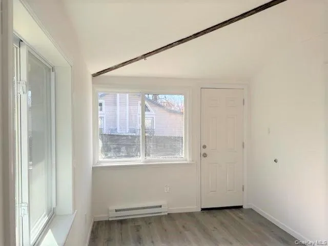 Living/Family Room w/vaulted ceilings & door to level back yard. Living/Family Room w/vaulted ceilings & door to level back yard.