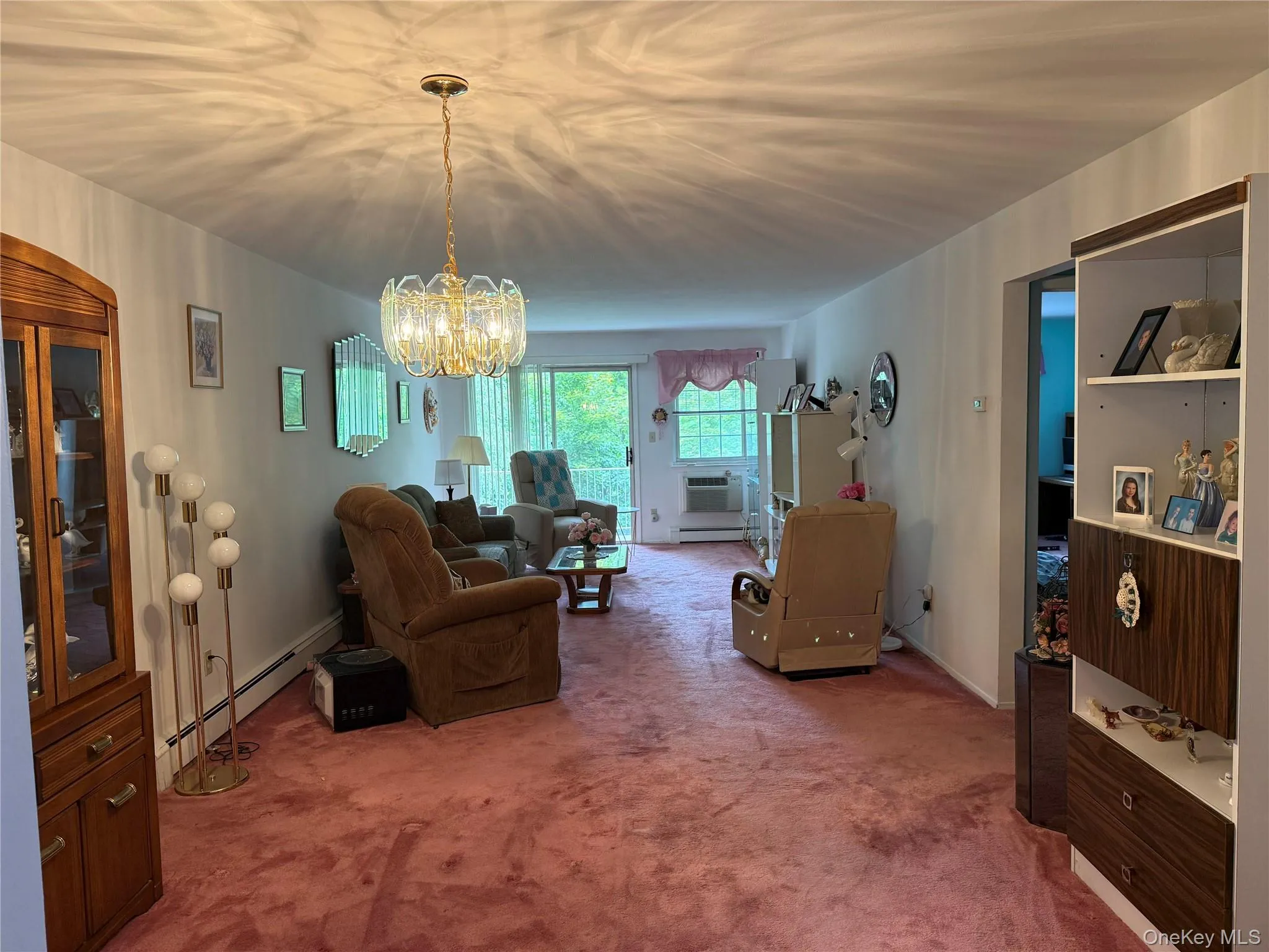 Large Living Room w/sliders out to Balcony over looking trees Large Living Room w/sliders out to Balcony over looking trees