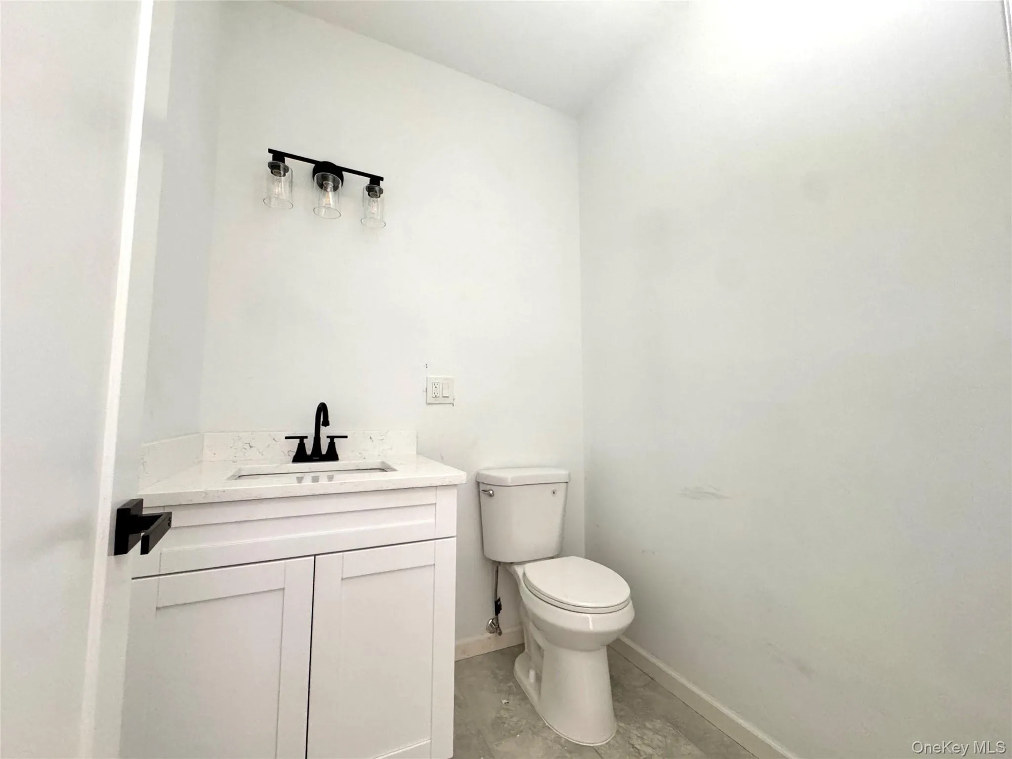 Powder Room featuring a sink with vanity Powder Room featuring a sink with vanity
