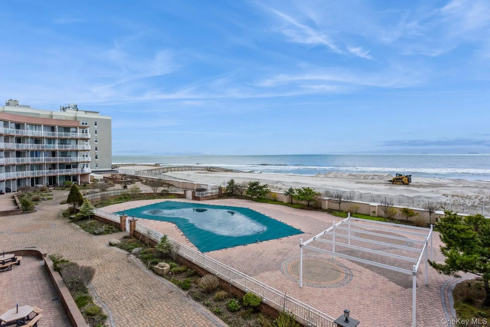 View of pool featuring a view of the beach and a water view View of pool featuring a view of the beach and a water view