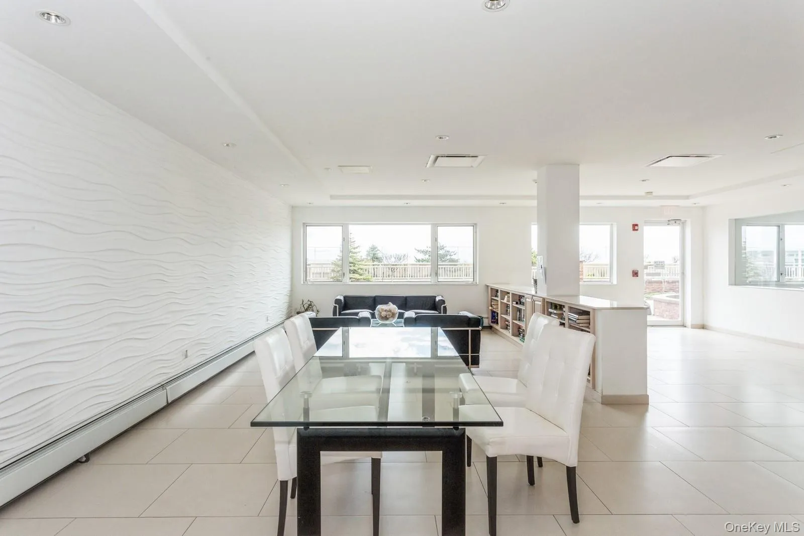 Dining room with light tile patterned floors, visible vents, and baseboards Dining room with light tile patterned floors, visible vents, and baseboards