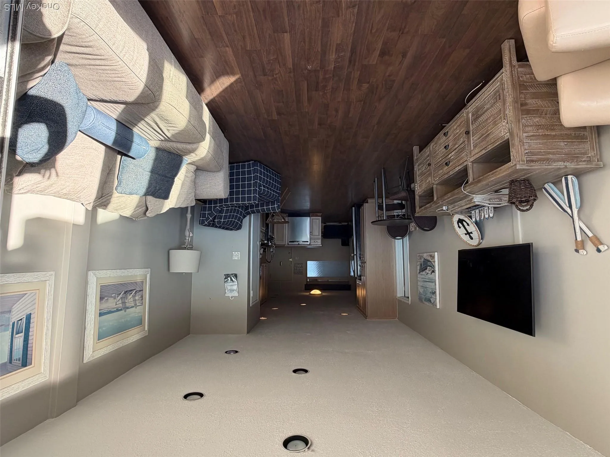 Living area with dark wood-style floors, a textured ceiling, and recessed lighting Living area with dark wood-style floors, a textured ceiling, and recessed lighting