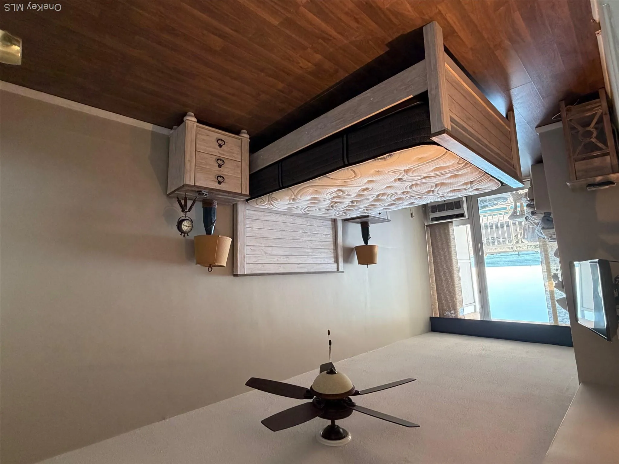 Bedroom with access to outside, dark wood-style flooring, and ceiling fan Bedroom with access to outside, dark wood-style flooring, and ceiling fan
