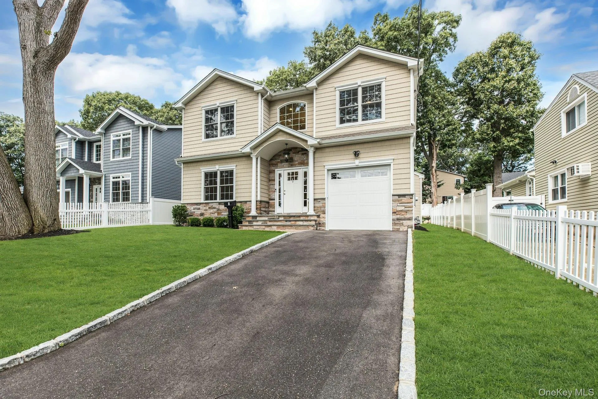 Fron of the home with long driveway. Fron of the home with long driveway.
