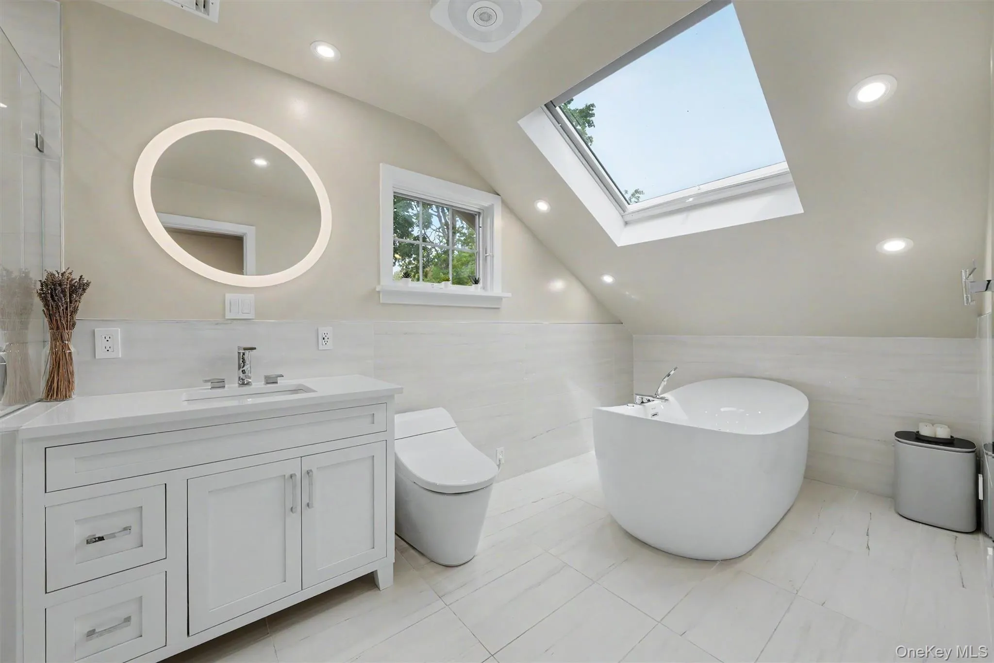 Beautifully updated full bathroom with skylight and Woodbridge soaking tub with jets & Kohler toilet Beautifully updated full bathroom with skylight and Woodbridge soaking tub with jets & Kohler toilet
