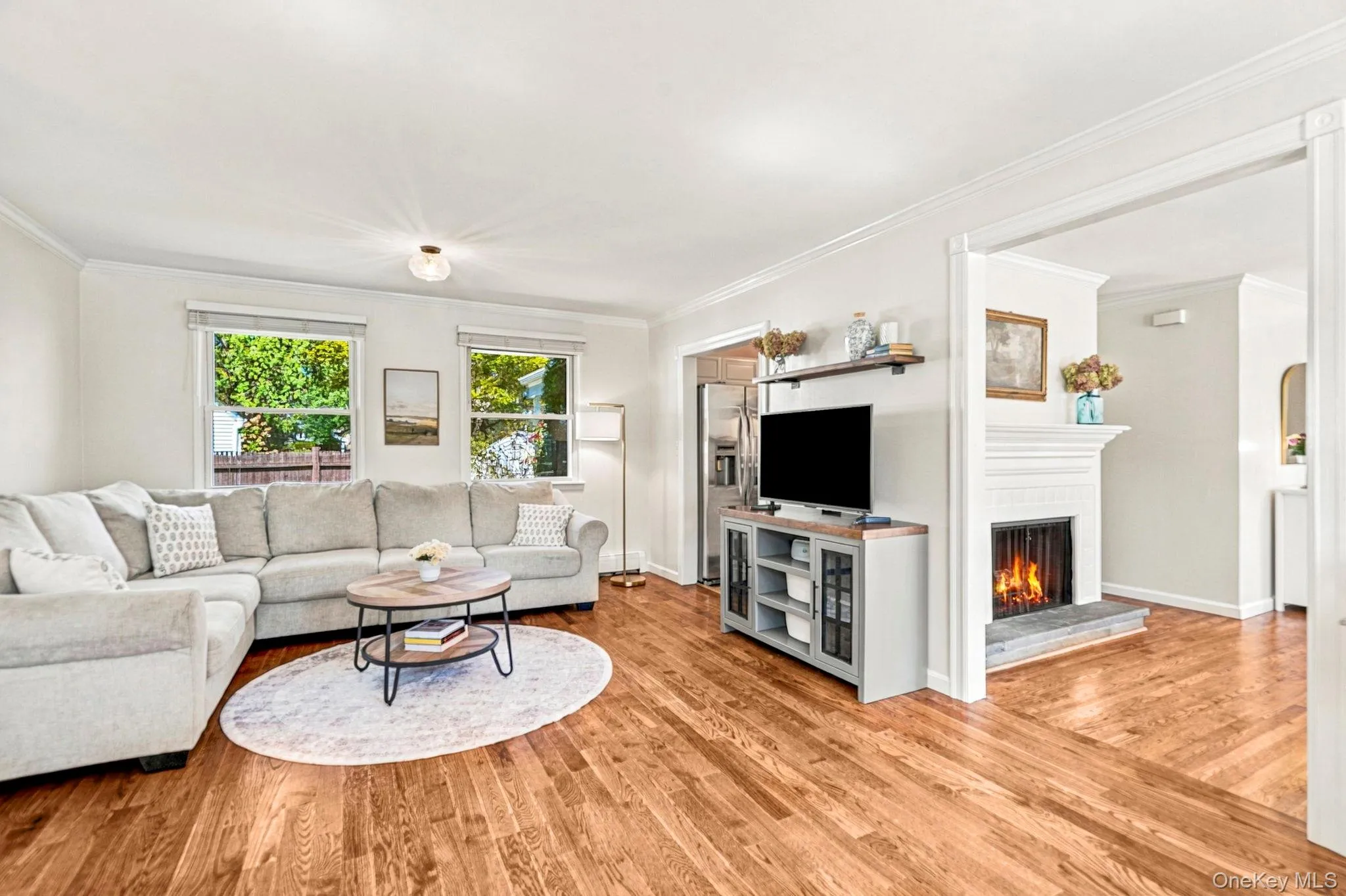 The living room seamlessly connects to the dining area as well as the kitchen The living room seamlessly connects to the dining area as well as the kitchen