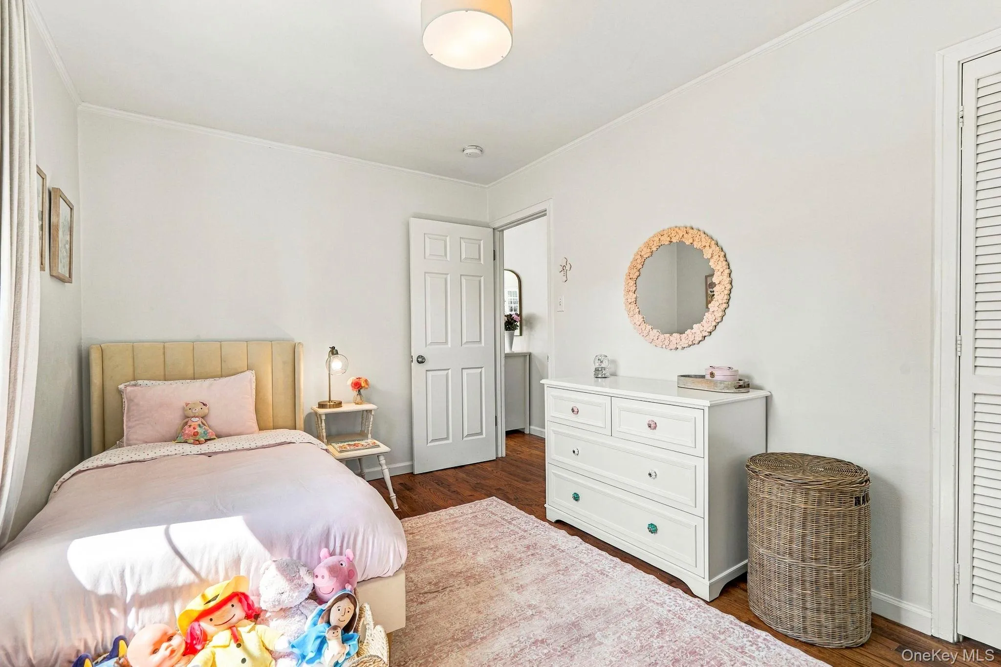 Warm wood-finish flooring complements light-toned walls Warm wood-finish flooring complements light-toned walls