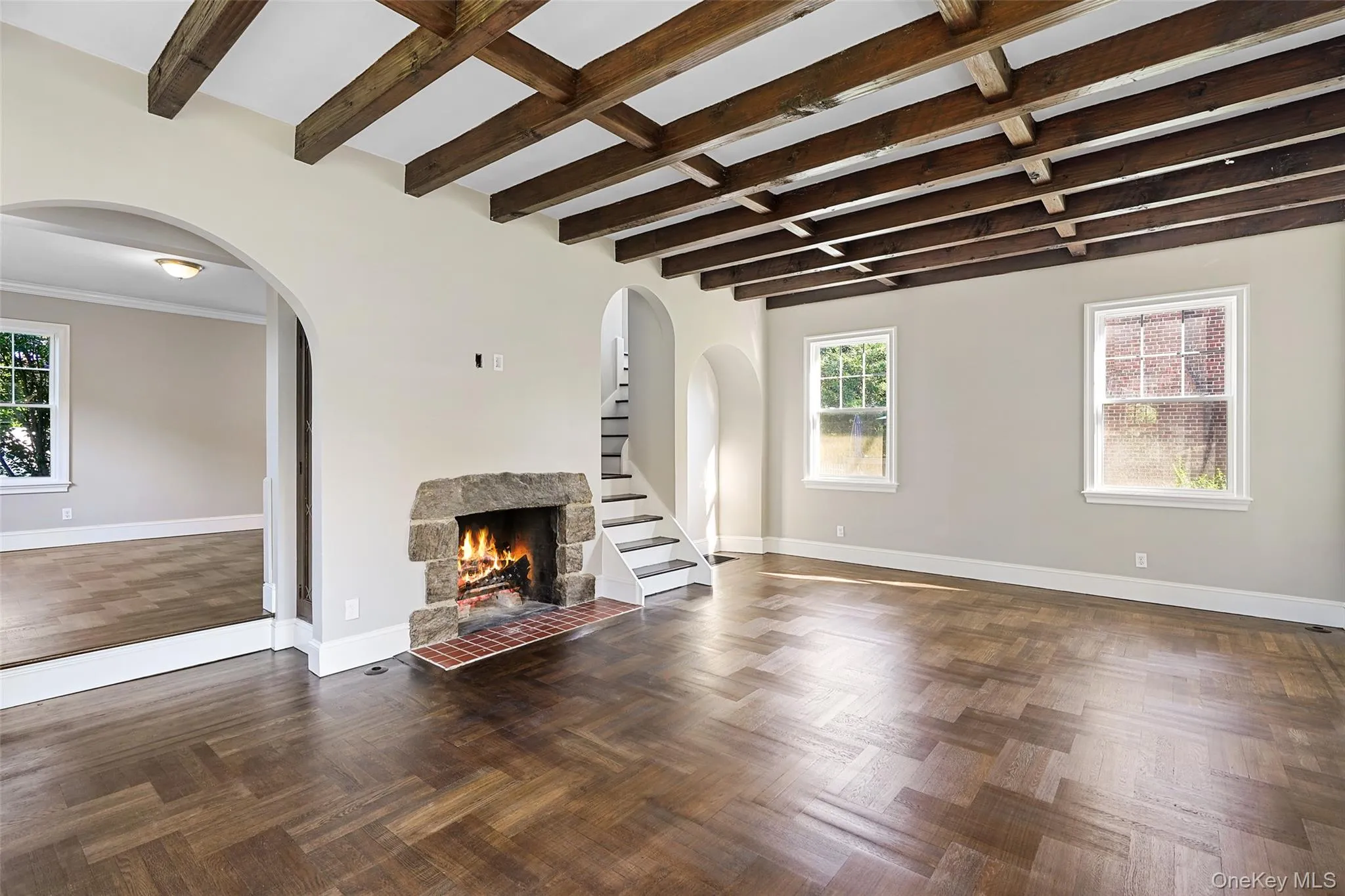Living Room featuring beamed ceiling. Living Room featuring beamed ceiling.