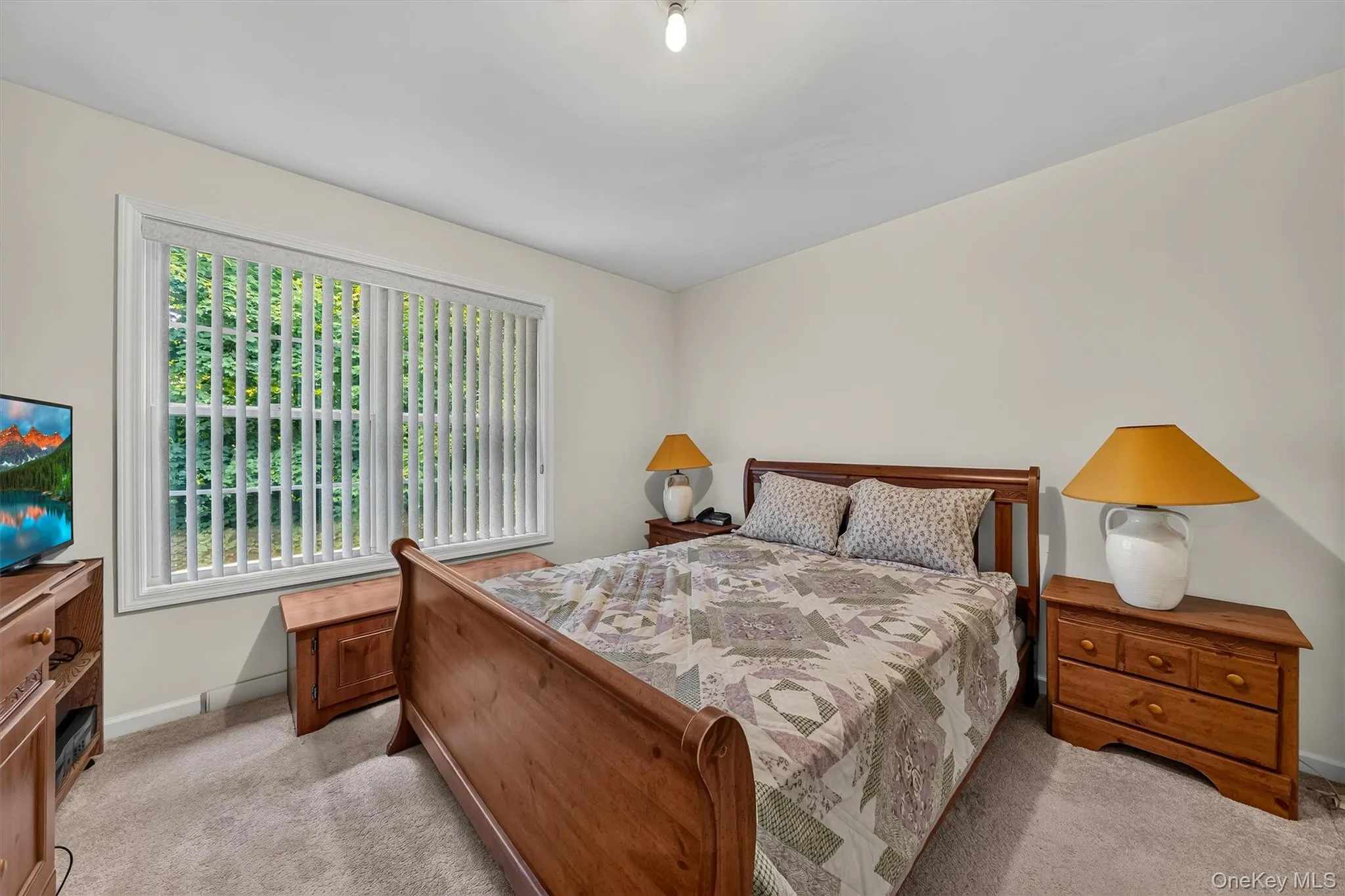 The second bedroom is large with another sunny window. The second bedroom is large with another sunny window.