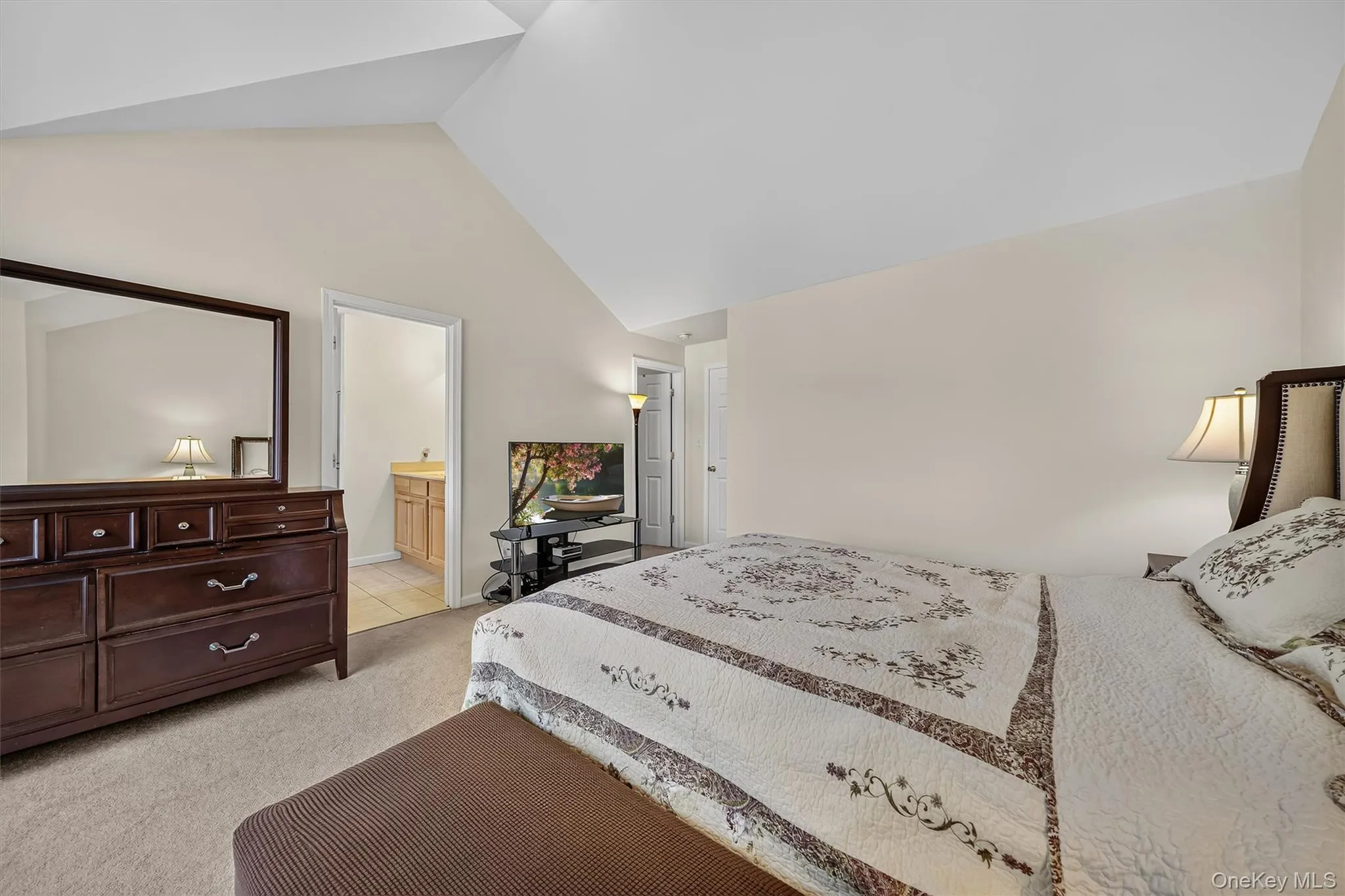 There is a walk in closet and a primary bath. There is a walk in closet and a primary bath.
