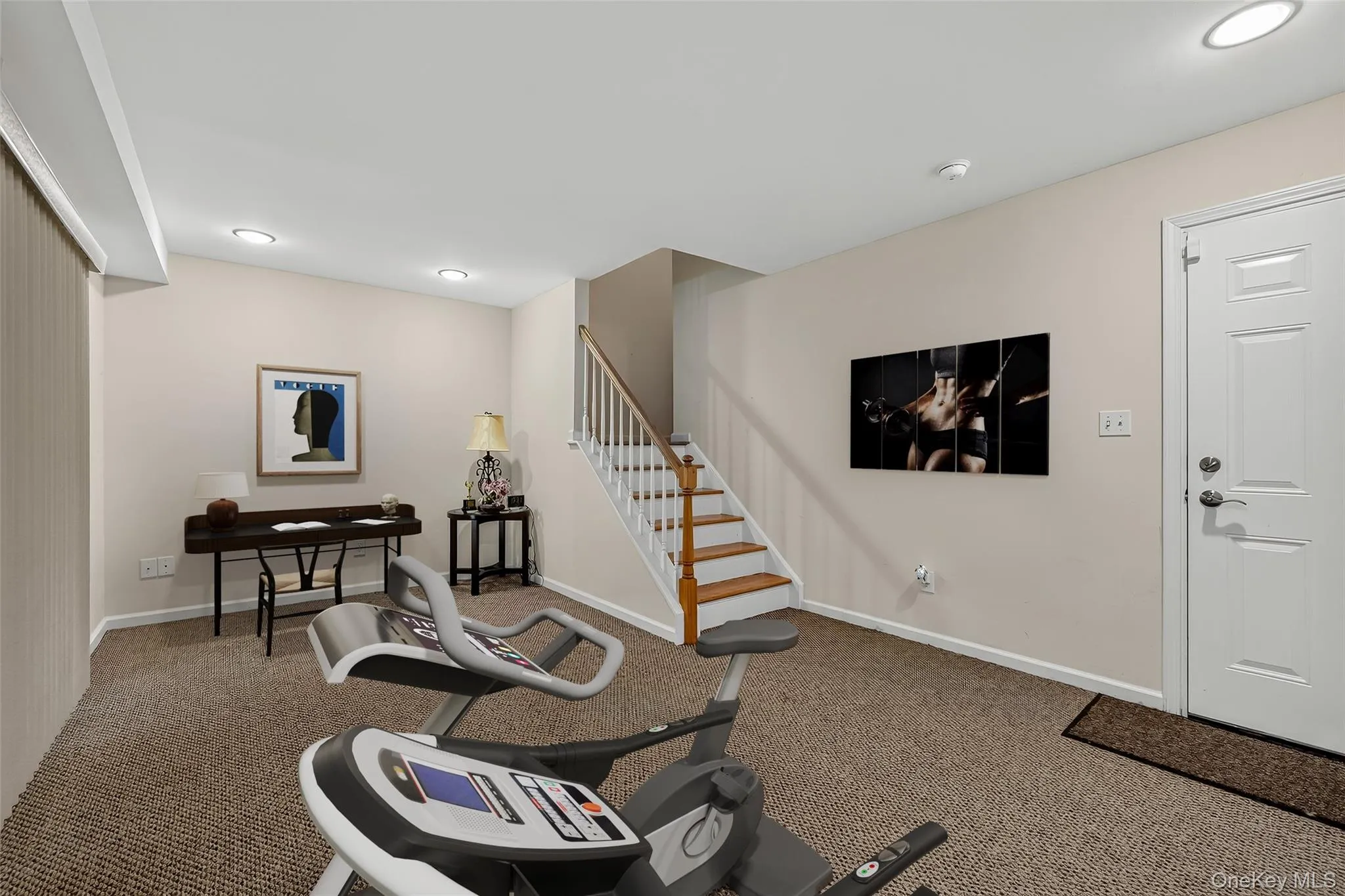 The finished lower level makes a great gym/home office Virtually staged. The finished lower level makes a great gym/home office Virtually staged.