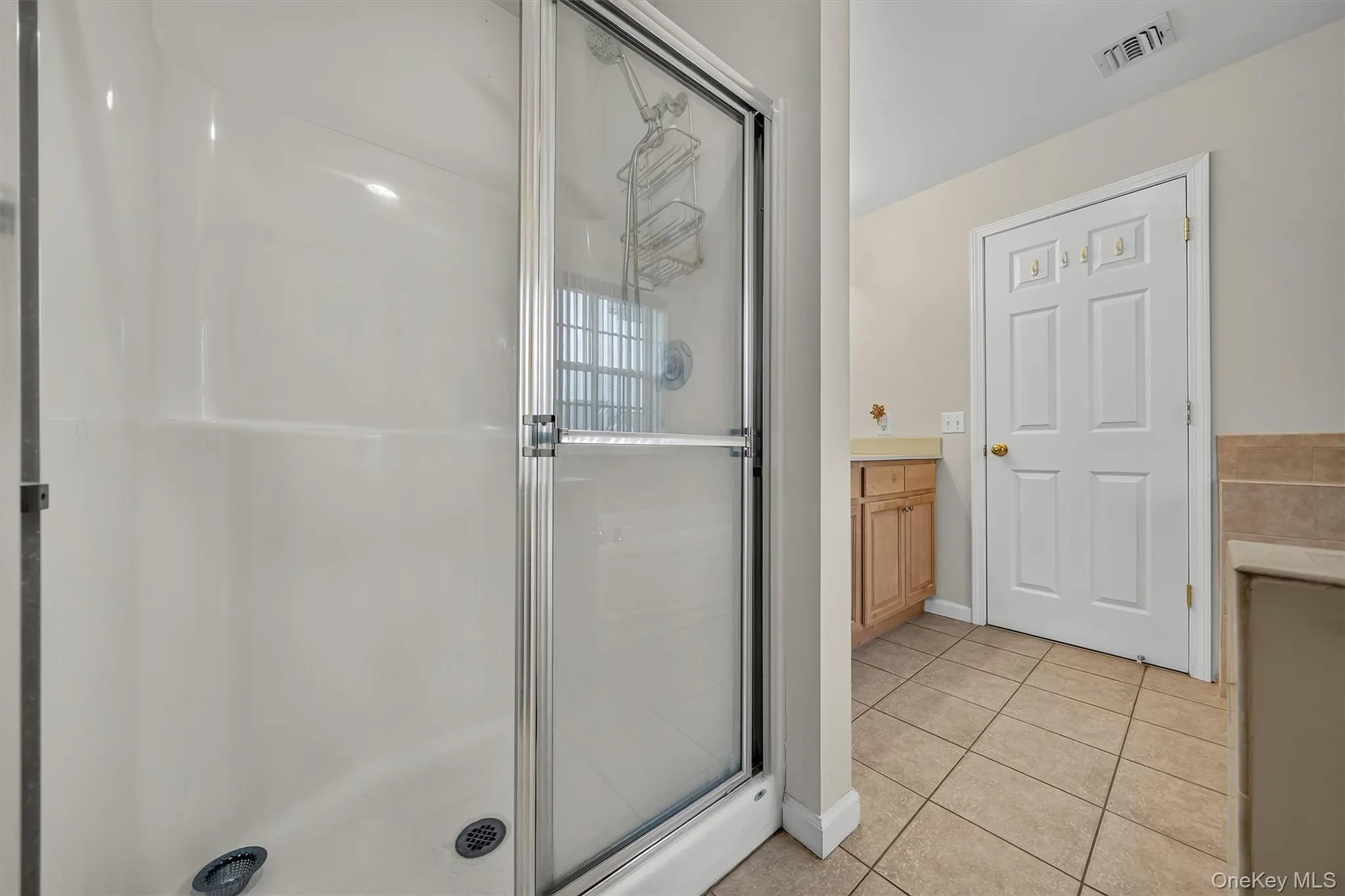 There is a separate shower in the primary bathroom. There is a separate shower in the primary bathroom.
