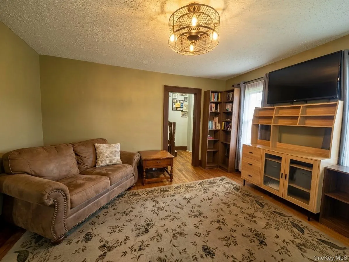 LIVING ROOM photo has been digitally altered to remove clutter and adjust lighting LIVING ROOM photo has been digitally altered to remove clutter and adjust lighting