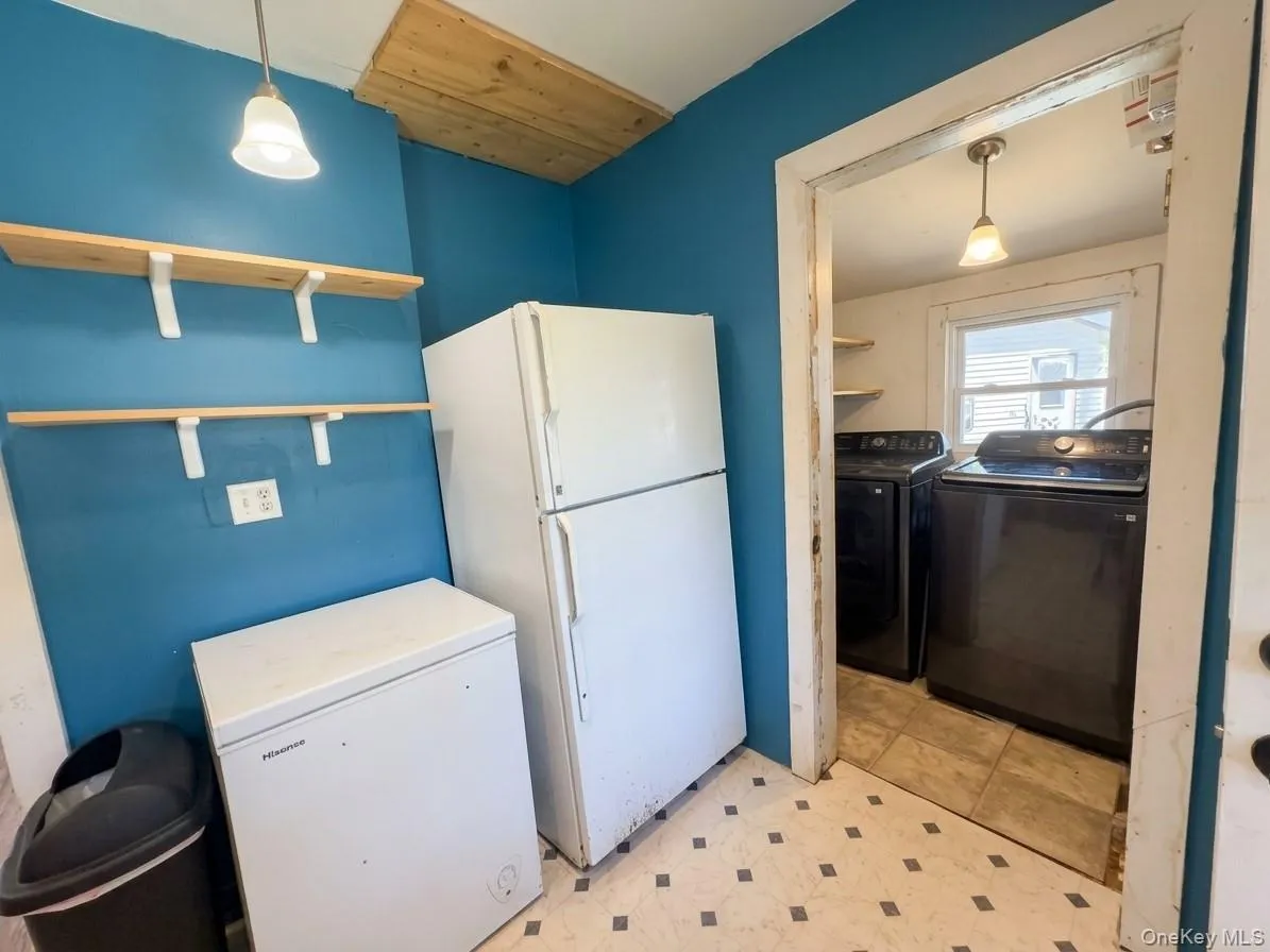 Photo has been digitally altered to remove clutter and adjust lighting. washer and dryer not included in sale. Photo has been digitally altered to remove clutter and adjust lighting. washer and dryer not included in sale.