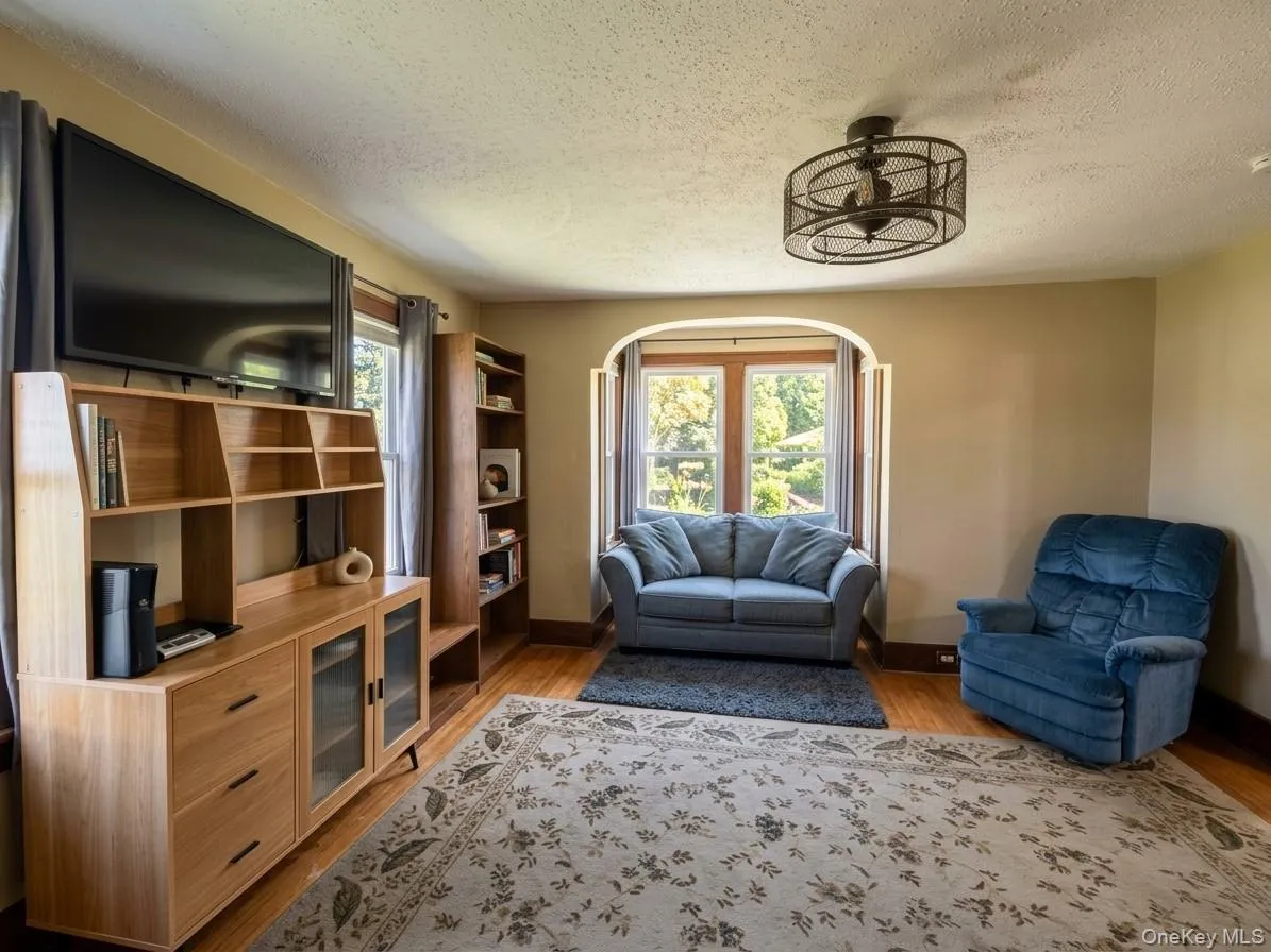living room photo has been digitally altered to remove clutter and adjust lighting living room photo has been digitally altered to remove clutter and adjust lighting