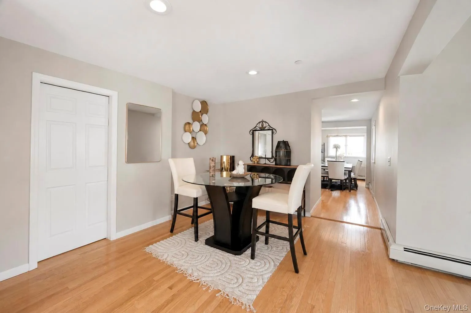Hardwood flooring, recessed lighting, and light gray wall paint Hardwood flooring, recessed lighting, and light gray wall paint