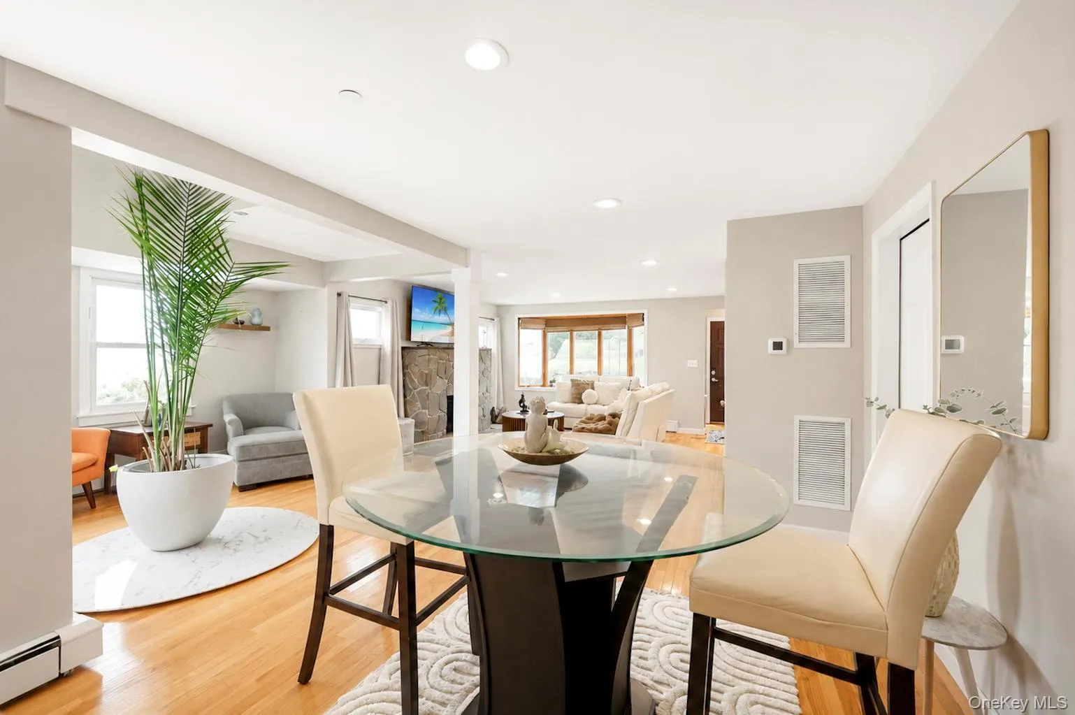 Hardwood flooring, recessed lighting, and an open layout Hardwood flooring, recessed lighting, and an open layout