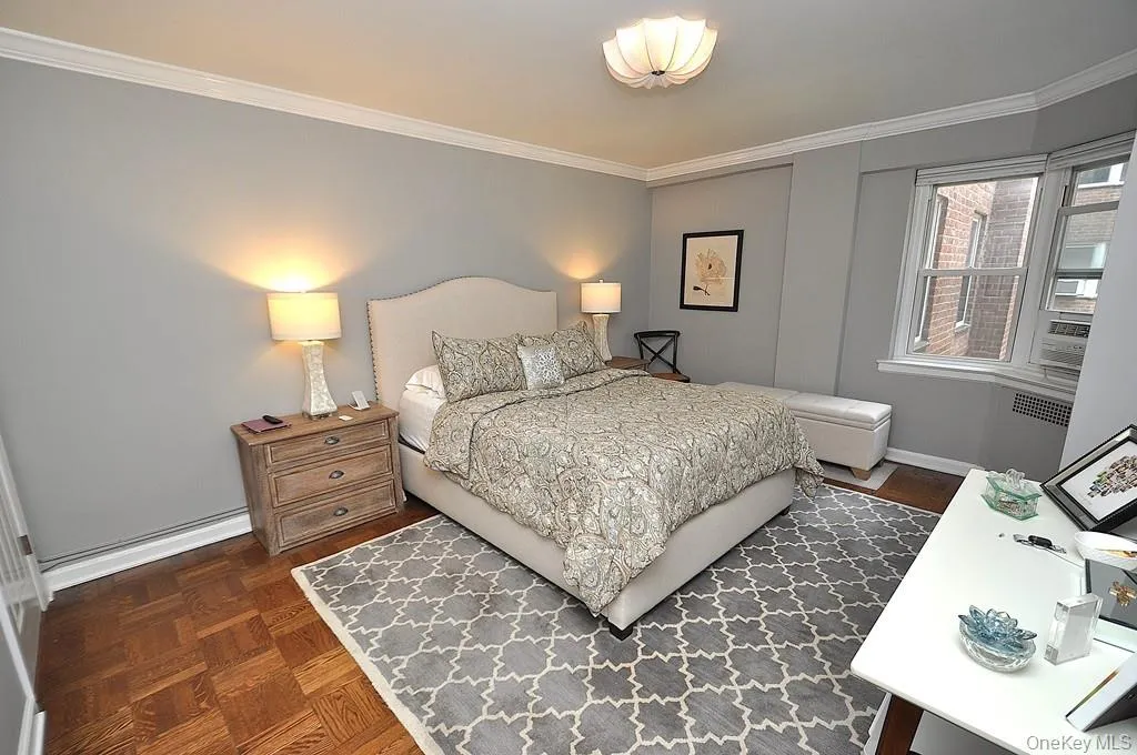 The large bedroom has two closets, a bay window and refinished parquet floors. The bedroom is approx. 15'-4" x 11'-9". The large bedroom has two closets, a bay window and refinished parquet floors. The bedroom is approx. 15'-4" x 11'-9".