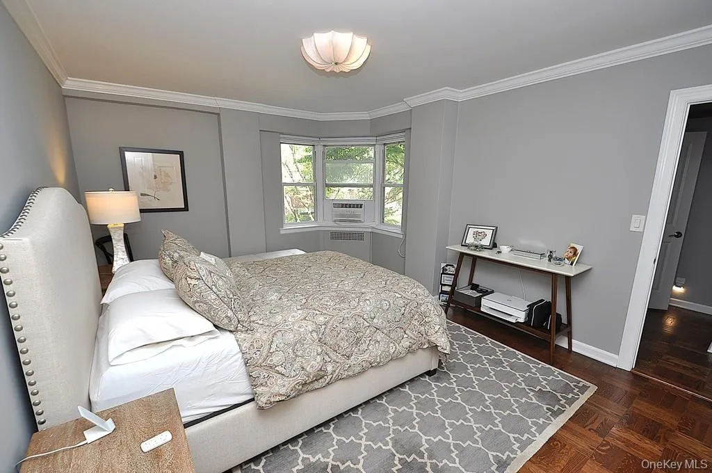 The large bedroom has two closets, a bay window and refinished parquet floors. The bedroom is approx. 15'-4" x 11'-9". The large bedroom has two closets, a bay window and refinished parquet floors. The bedroom is approx. 15'-4" x 11'-9".