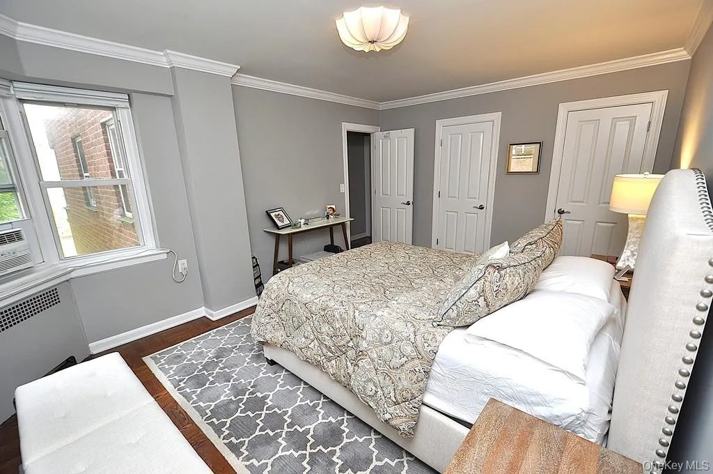 The large bedroom has two closets, a bay window and refinished parquet floors. The bedroom is approx. 15'-4" x 11'-9". The large bedroom has two closets, a bay window and refinished parquet floors. The bedroom is approx. 15'-4" x 11'-9".
