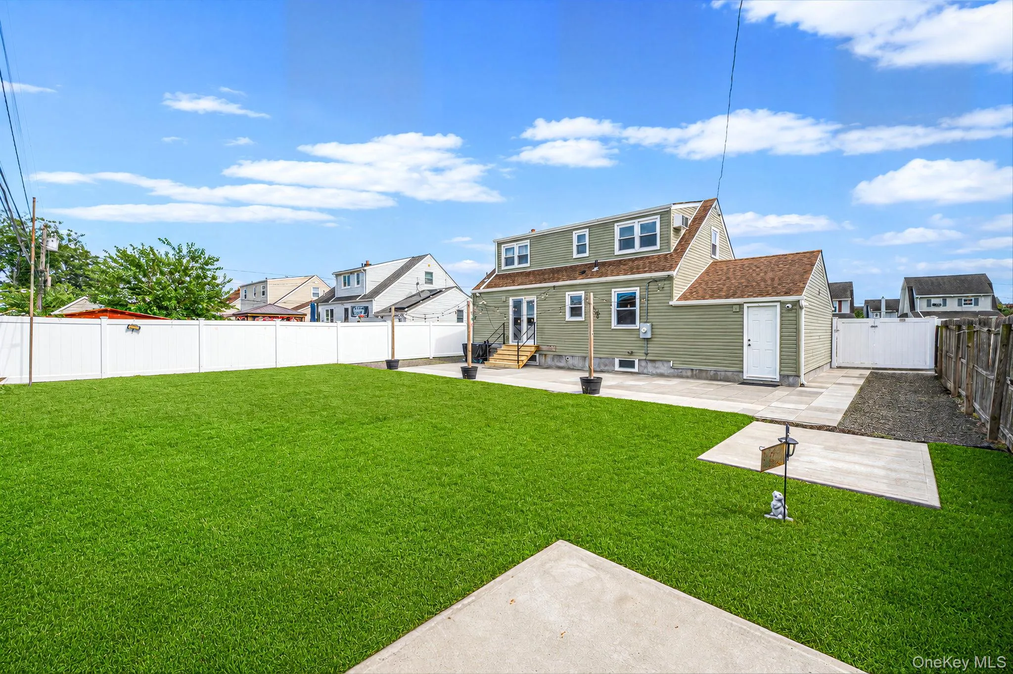 Backyard Patio and Bluestone rock gardens. Lawn digitally enhanced. Cement pads for sheds. Backyard Patio and Bluestone rock gardens. Lawn digitally enhanced. Cement pads for sheds.
