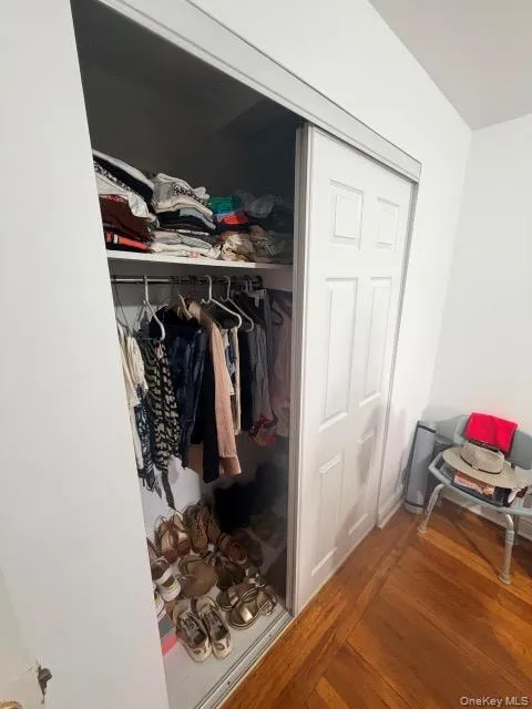 Sliding closet doors, built-in shelving, and a hanging rod Sliding closet doors, built-in shelving, and a hanging rod