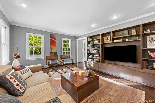 Recessed lighting, crown molding, wood-finish flooring, and multiple windows Recessed lighting, crown molding, wood-finish flooring, and multiple windows