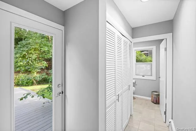 From kitchen. Laundry behind white louvered bifold doors, recessed ceiling lighting, and light gray wall paint From kitchen. Laundry behind white louvered bifold doors, recessed ceiling lighting, and light gray wall paint
