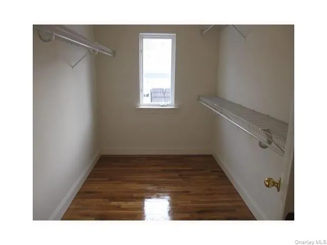 Huge walk in closet within the primary bedroom suite Huge walk in closet within the primary bedroom suite